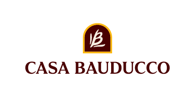 Logo of Casa Bauducco featuring a stylized pastry or bread icon with the brand name below in red text.