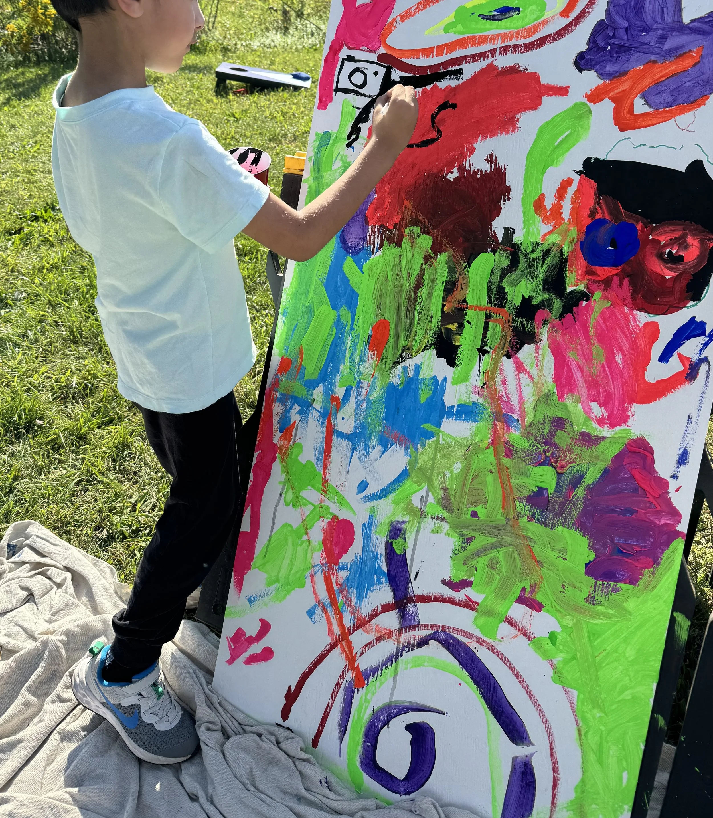 Child Painting Mural plein air.jpg