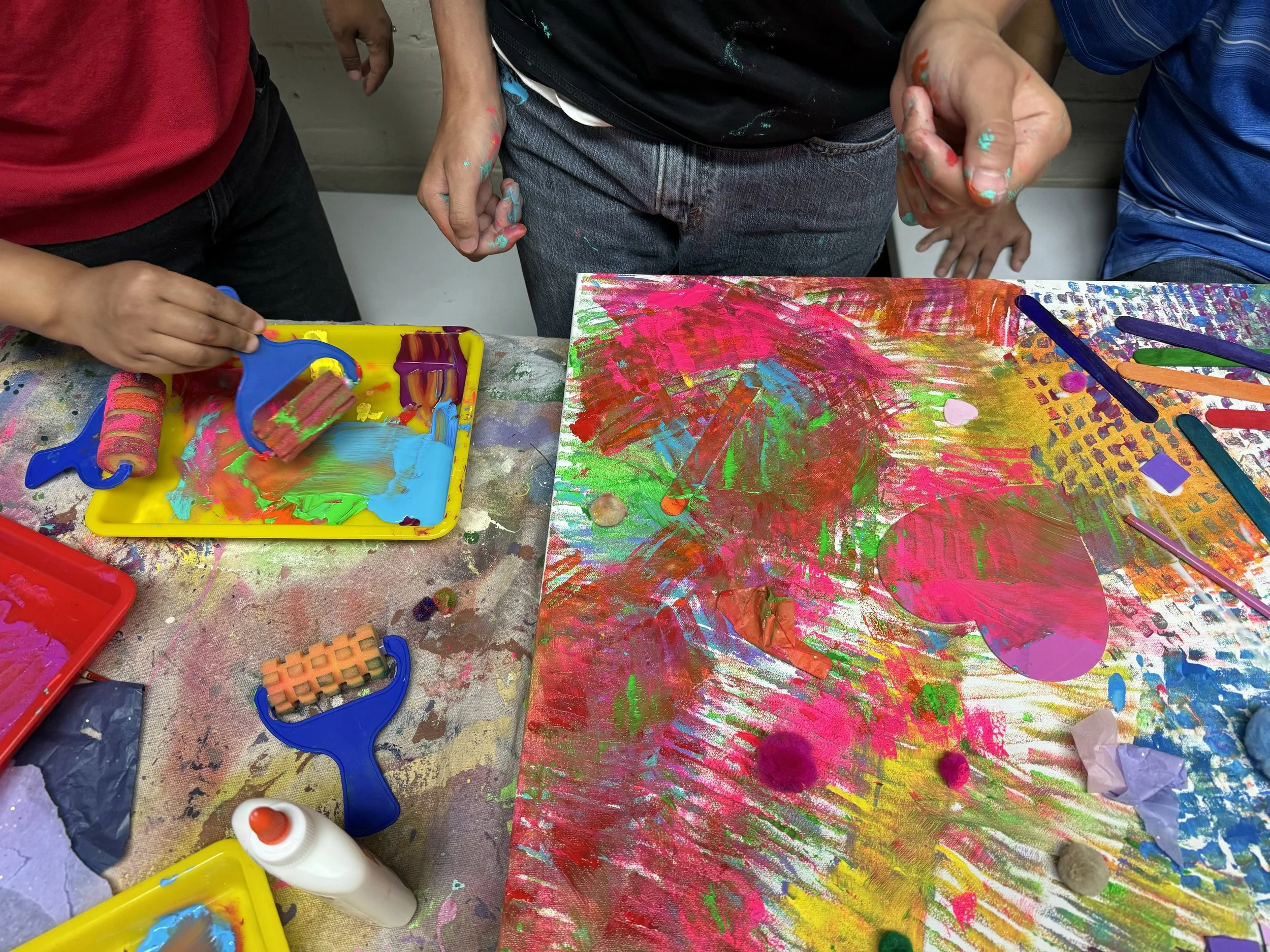 Team work painting large canvas.jpg