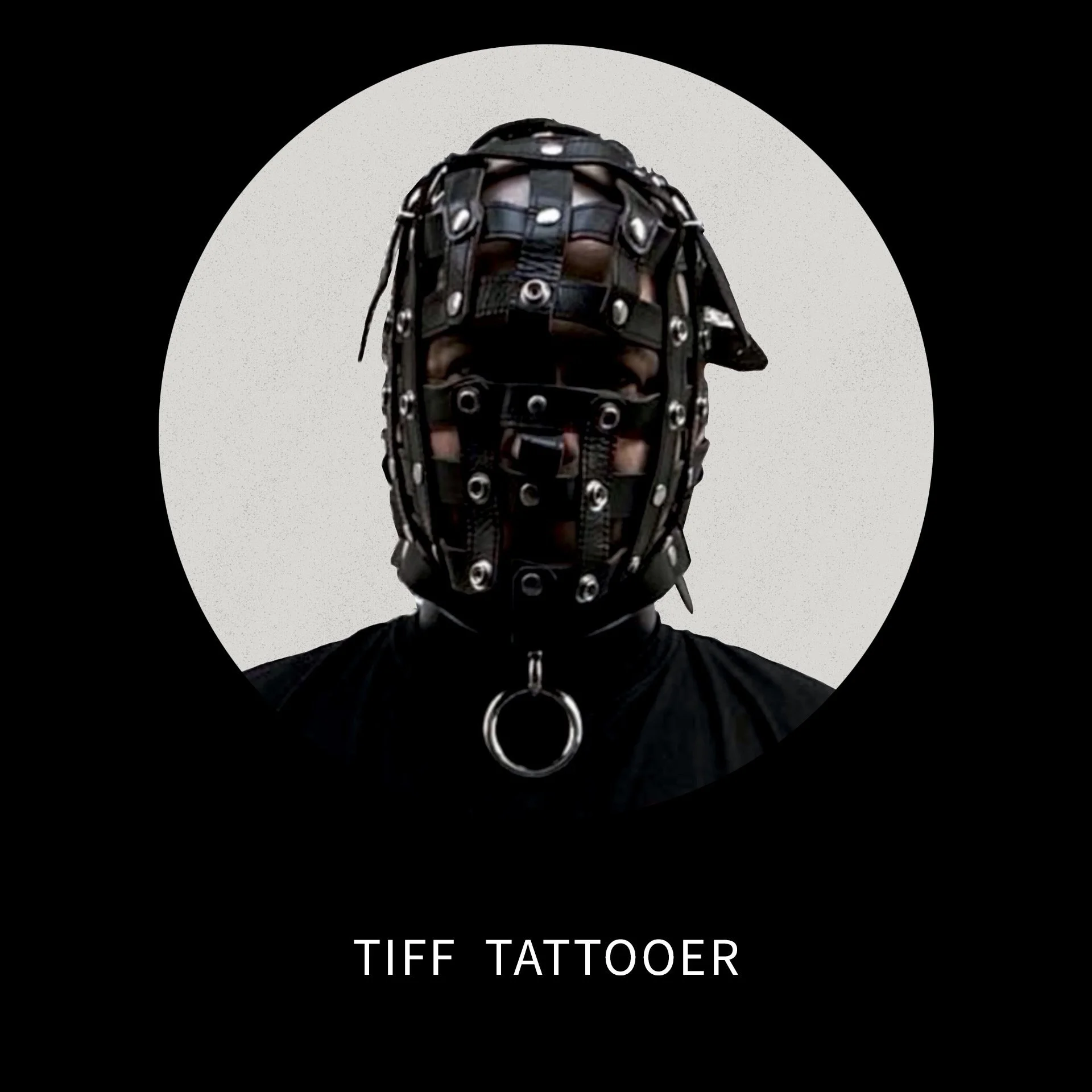 Person wearing a black leather mask with metal eyelets and straps, and a ring on collar, against a black background with white circular frame, labeled 'TIFF TATTOOER'.
