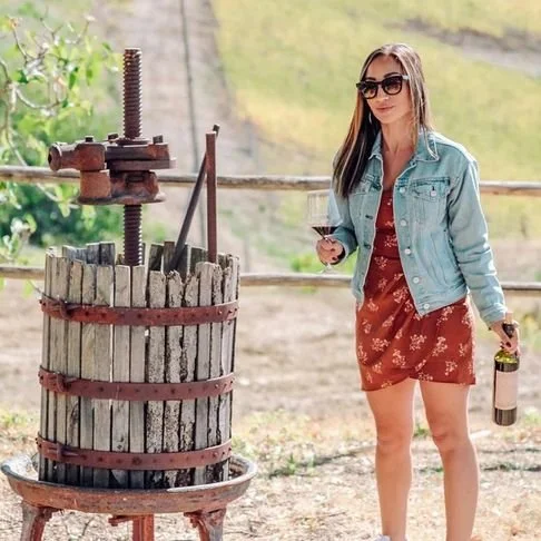 nicole-wine-blogger-with-wine-press.jpeg