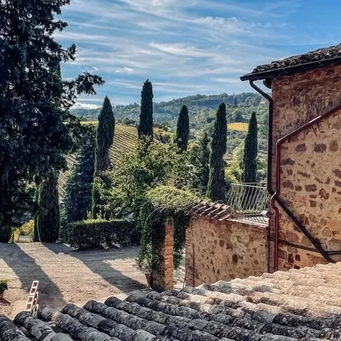 tuscan-vineyard-stone-buildings-cypress-trees.jpeg