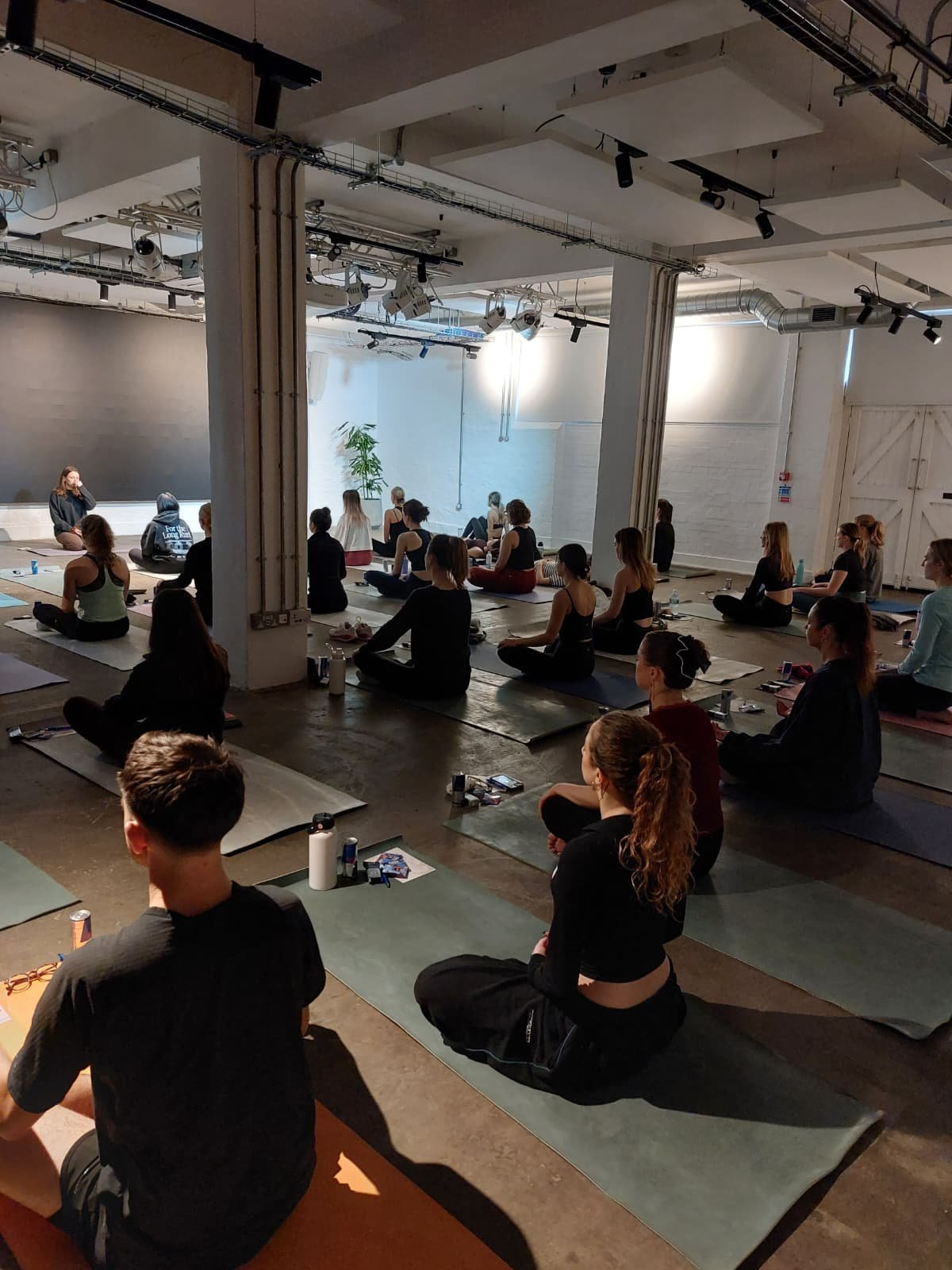 A group of people sat down engaging with a community workshop