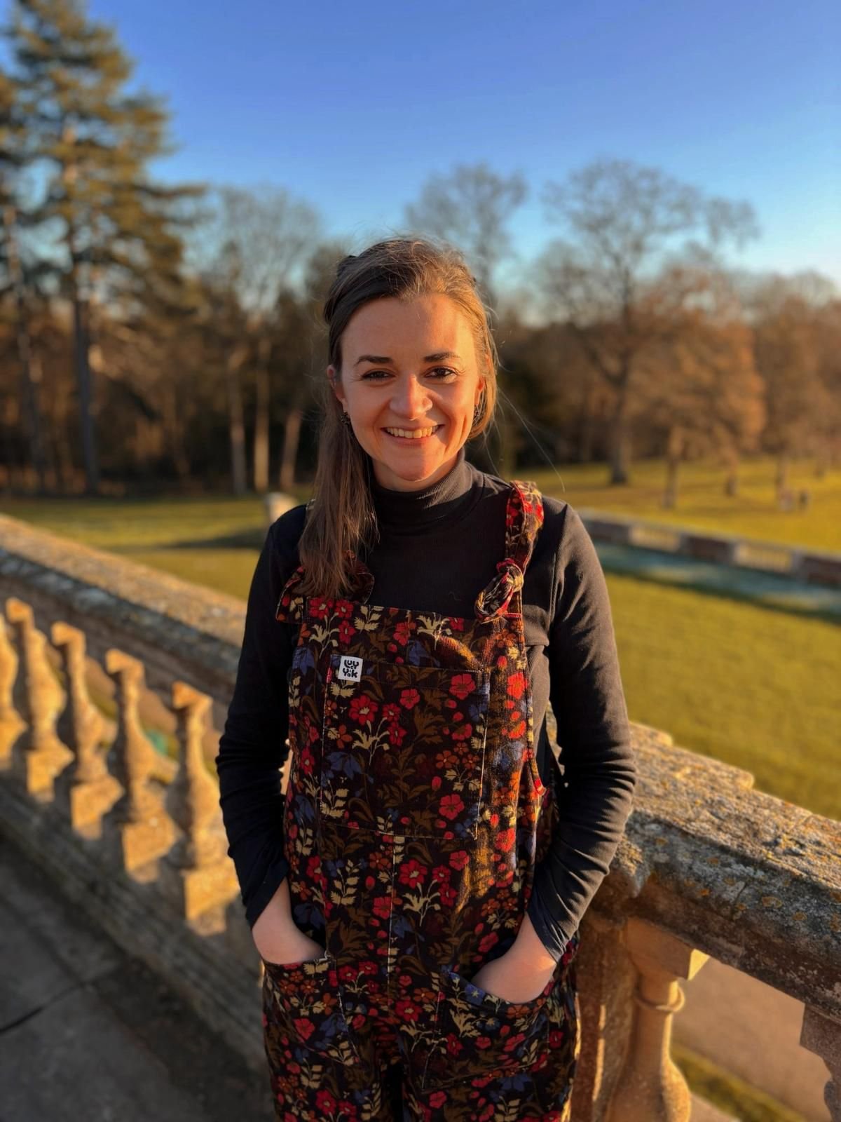Professional headshot of a therapist smiling warmly