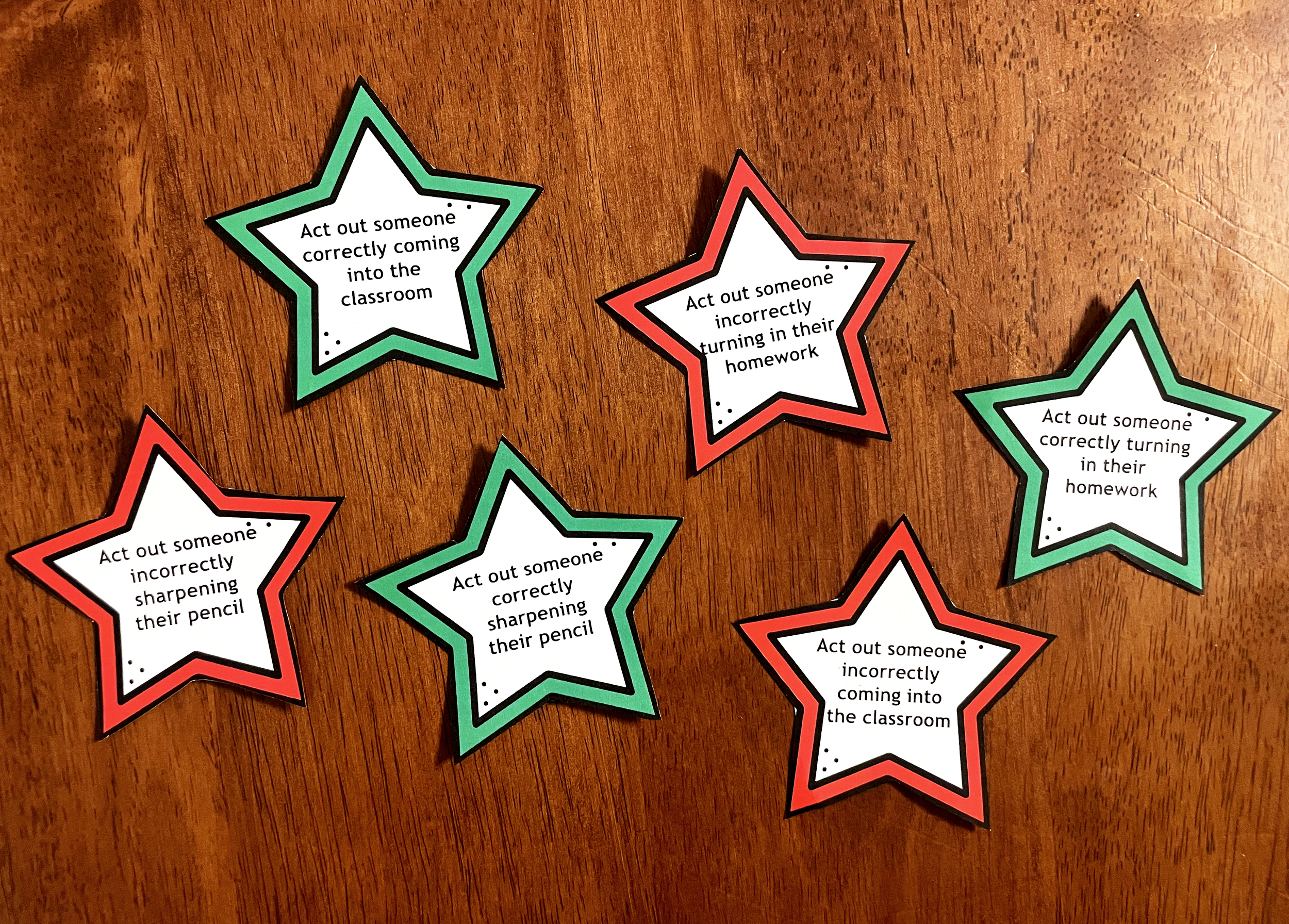 A classroom rules charades game on a desk for a first week after winter break activity