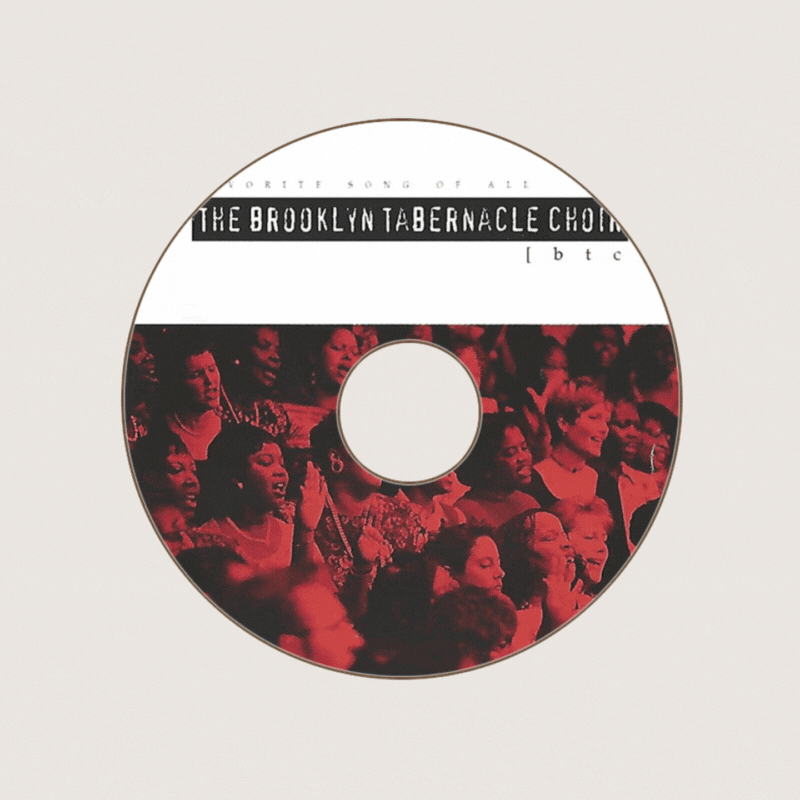 A CD with a black and white label featuring the text "The Brooklyn Tabernacle Choir" and a red-tinted photo of a choir singing.