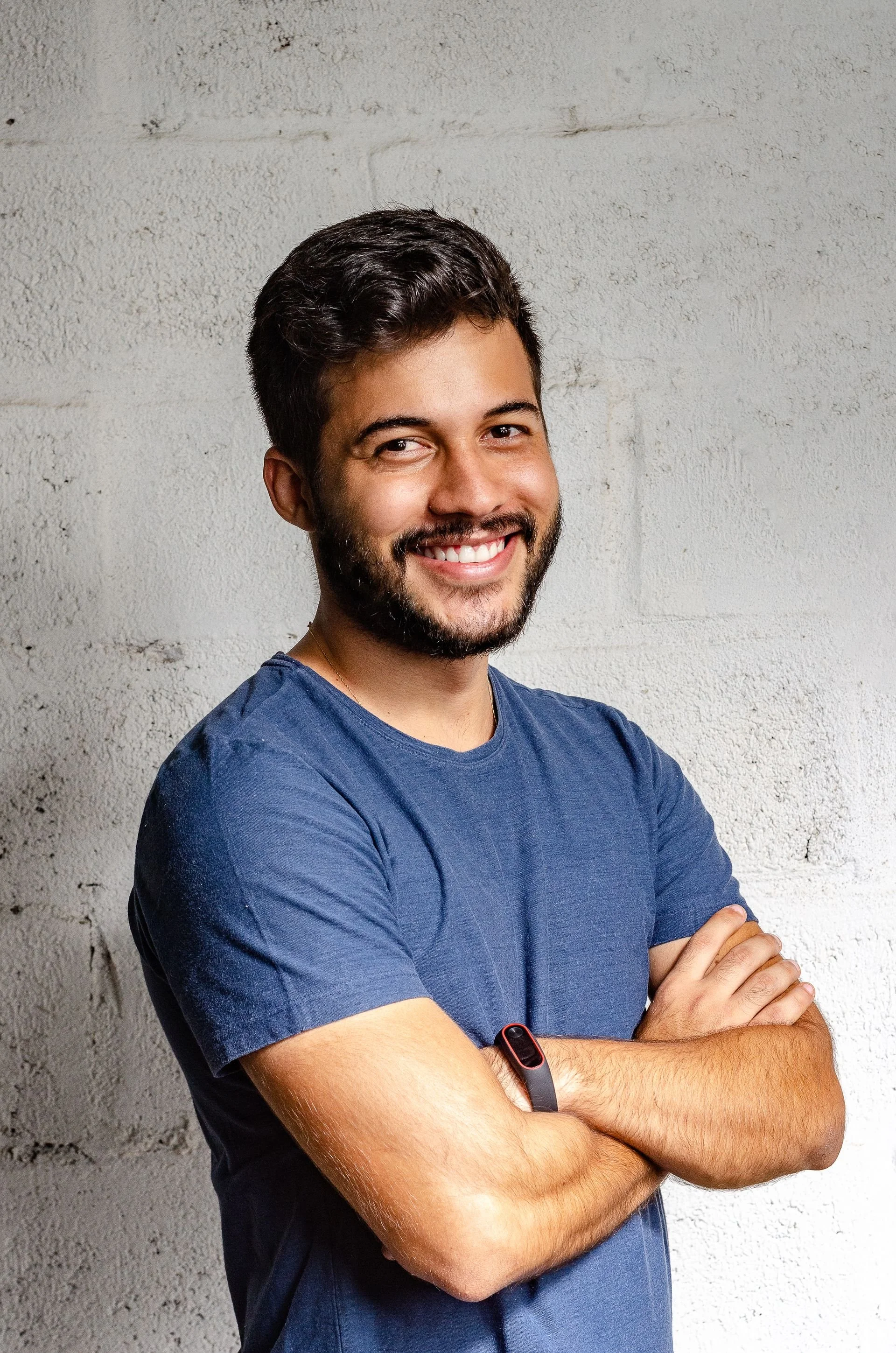 A smiling, energized male professional representing a fully resourced physiological baseline and sustainable physical vitality.