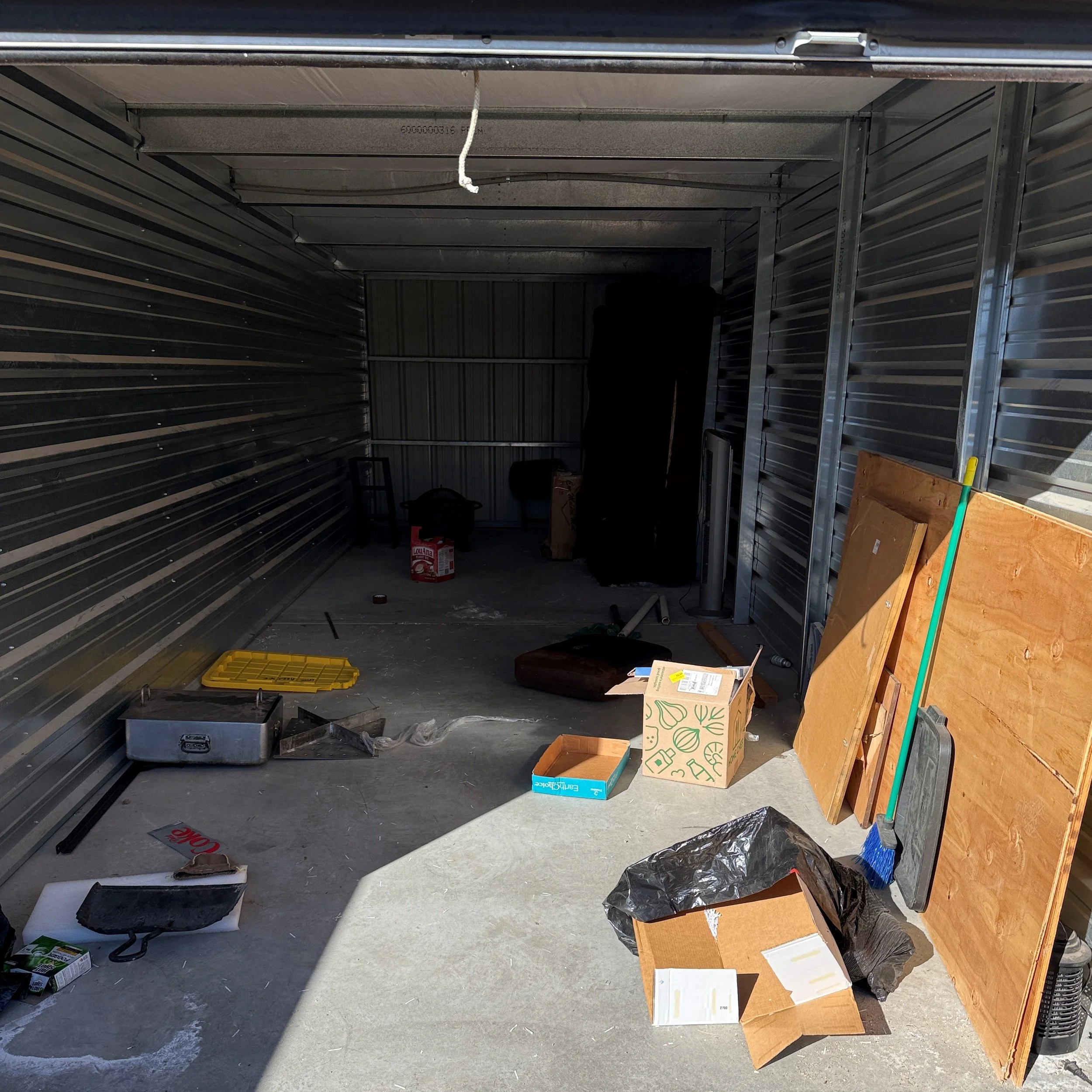A dirty storage unit located in Chino Valley, AZ before cleanout.
