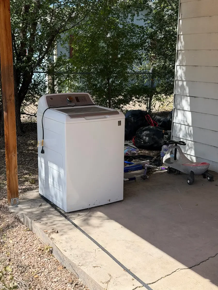 Chino Valley washing machine waiting to be hauled by Copper State Junk Removal