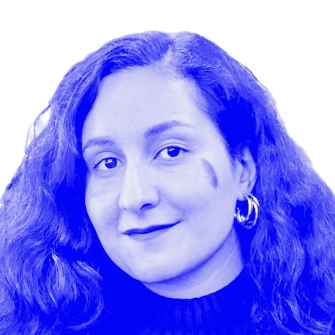 A blue-tinted photograph of Wahida Faizi