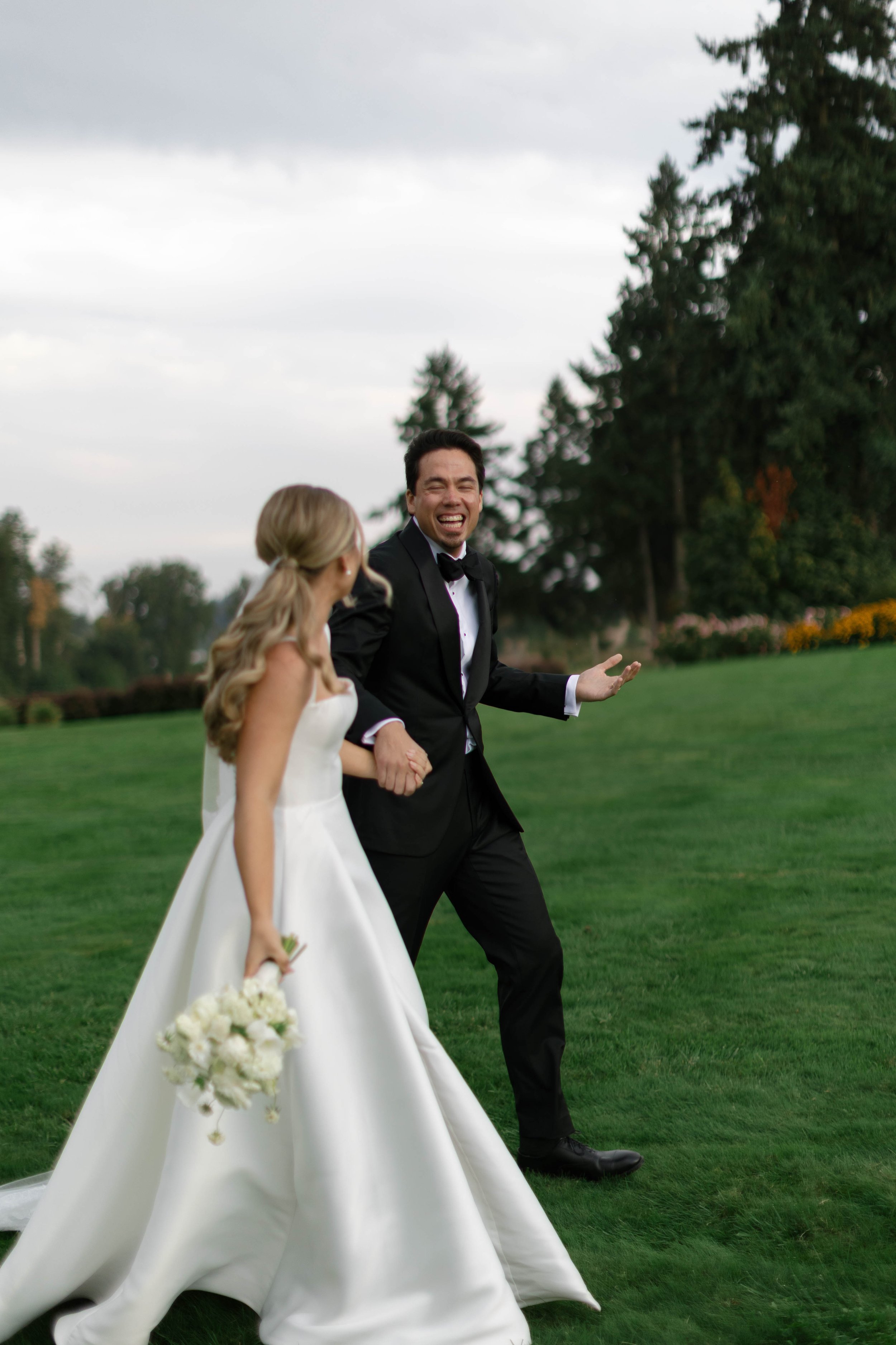The bride and groom celebrating after walking down the aisle at Del Mar Villa, Dundee Oregon