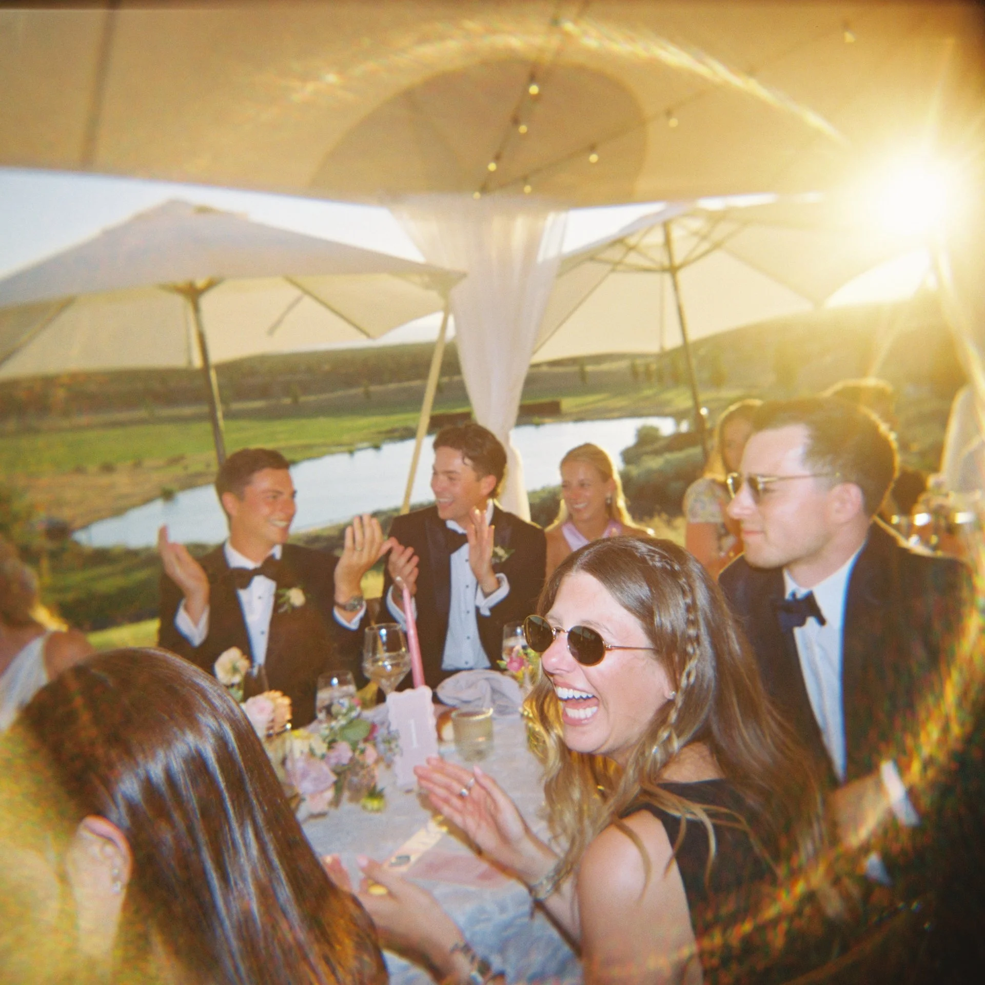 Guest cheering and clapping in golden light on film at Black Butte Ranch in Bend Oregon