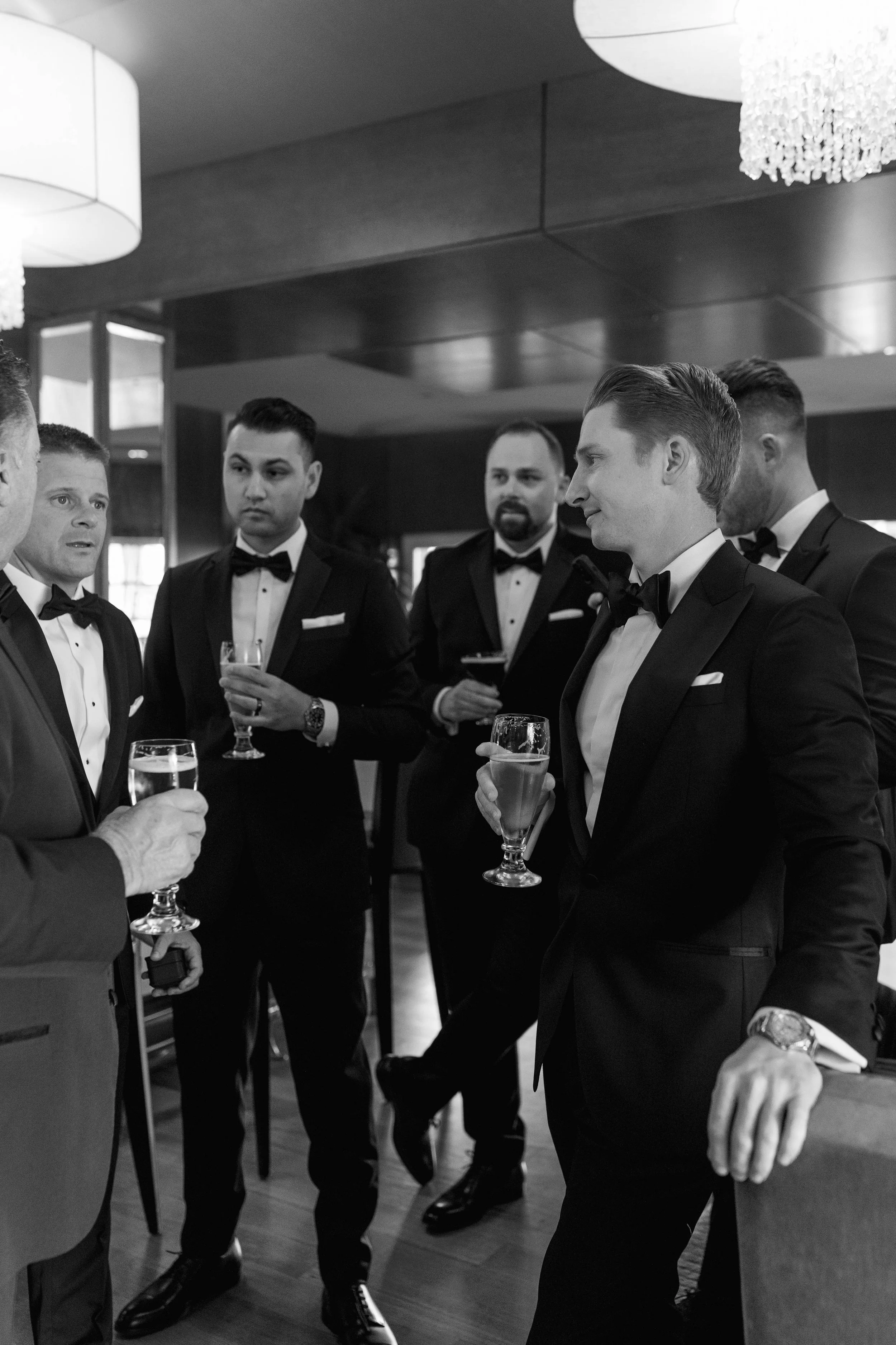 The groom and groomsmen having a drink in the lounge at the Beverly Hills Hotel, Los Angeles California