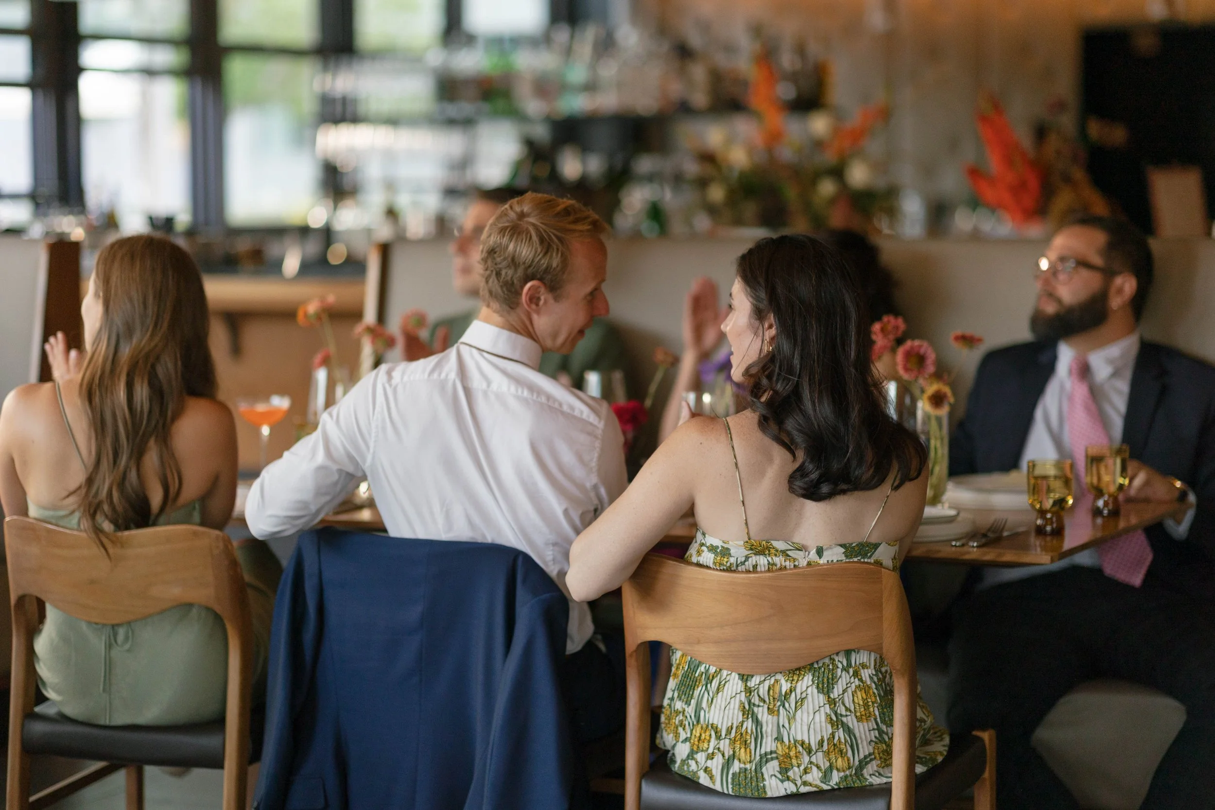 Guests sharing a moment at dinner at Corrida in Boulder Colorado