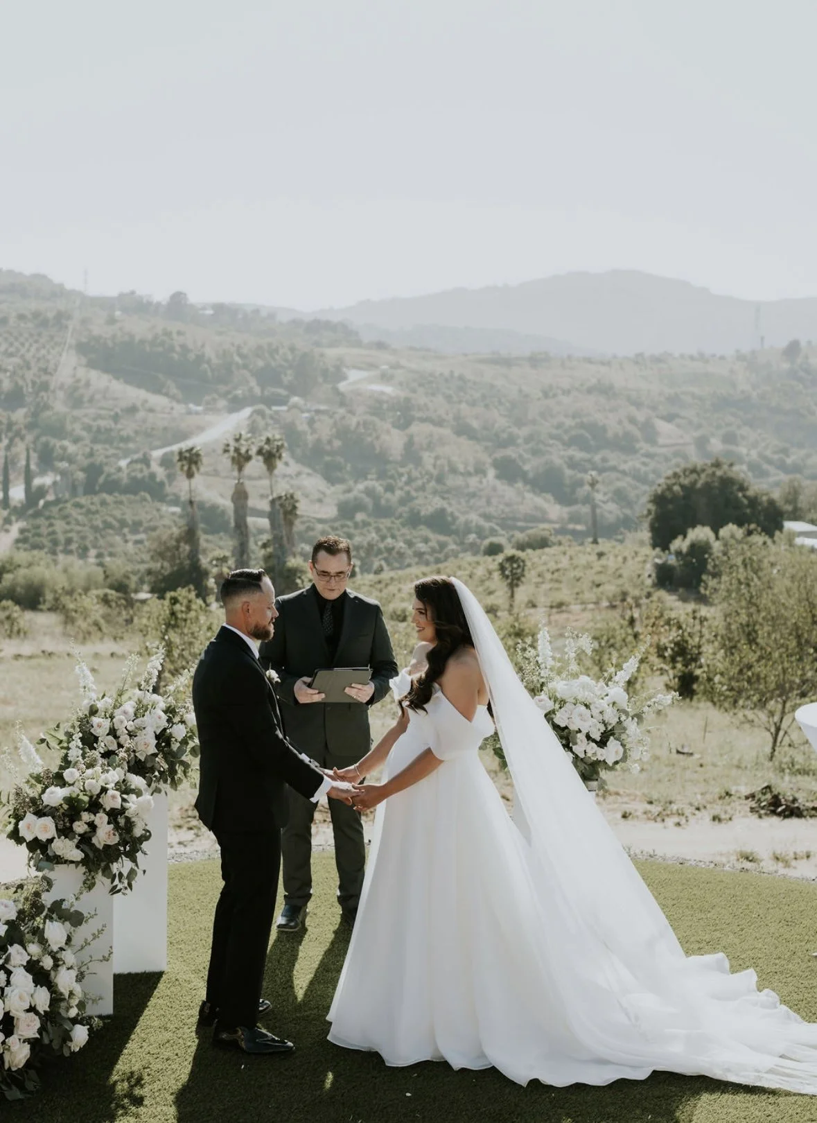 bride & groom on hillside