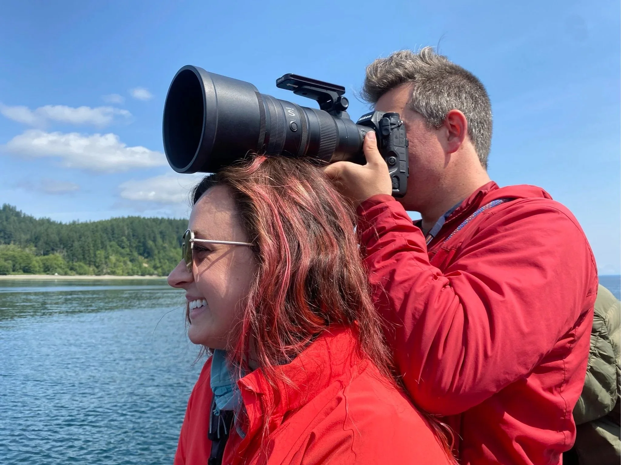 Brooke as an impromptu camera tripod on a whale watching trip with her husband Michael