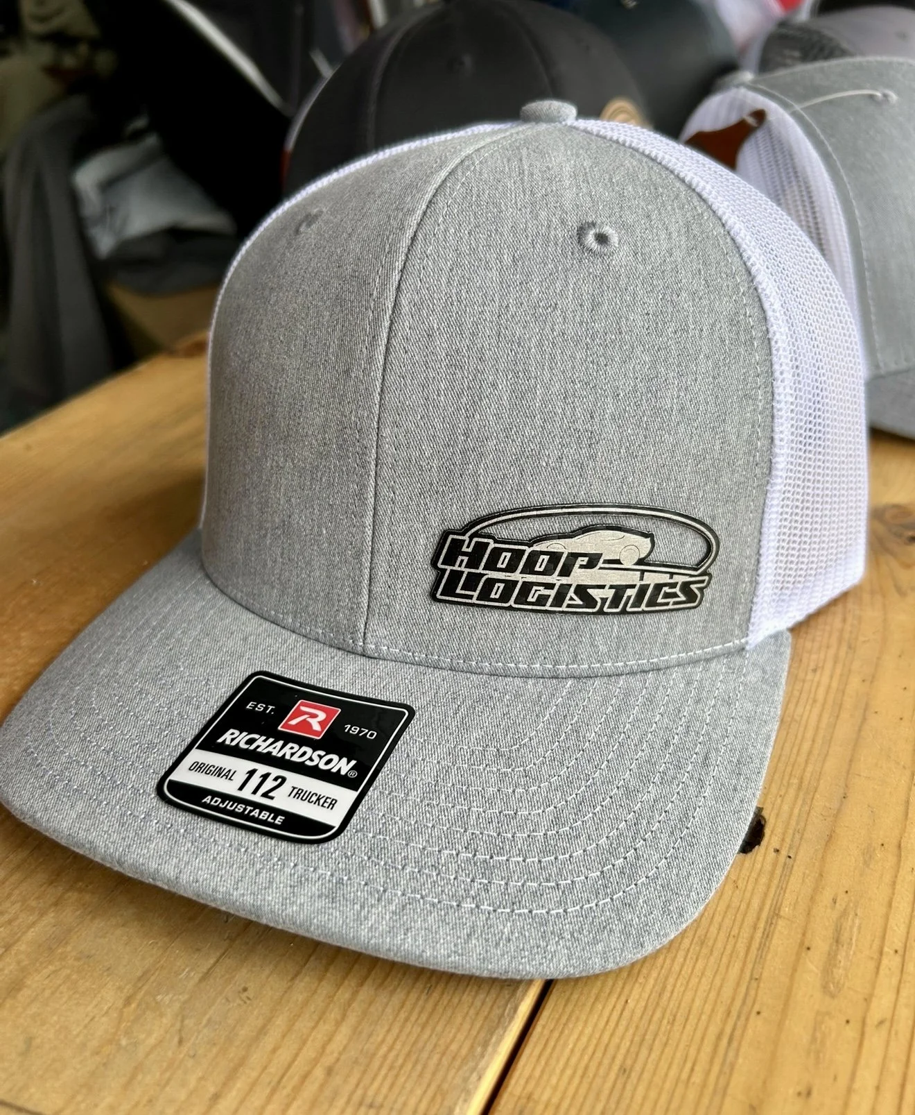 Gray and white trucker hat with a