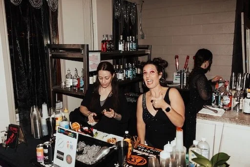 pierpont-place-private-party-bartenders-smiling-serving-drinks.jpg