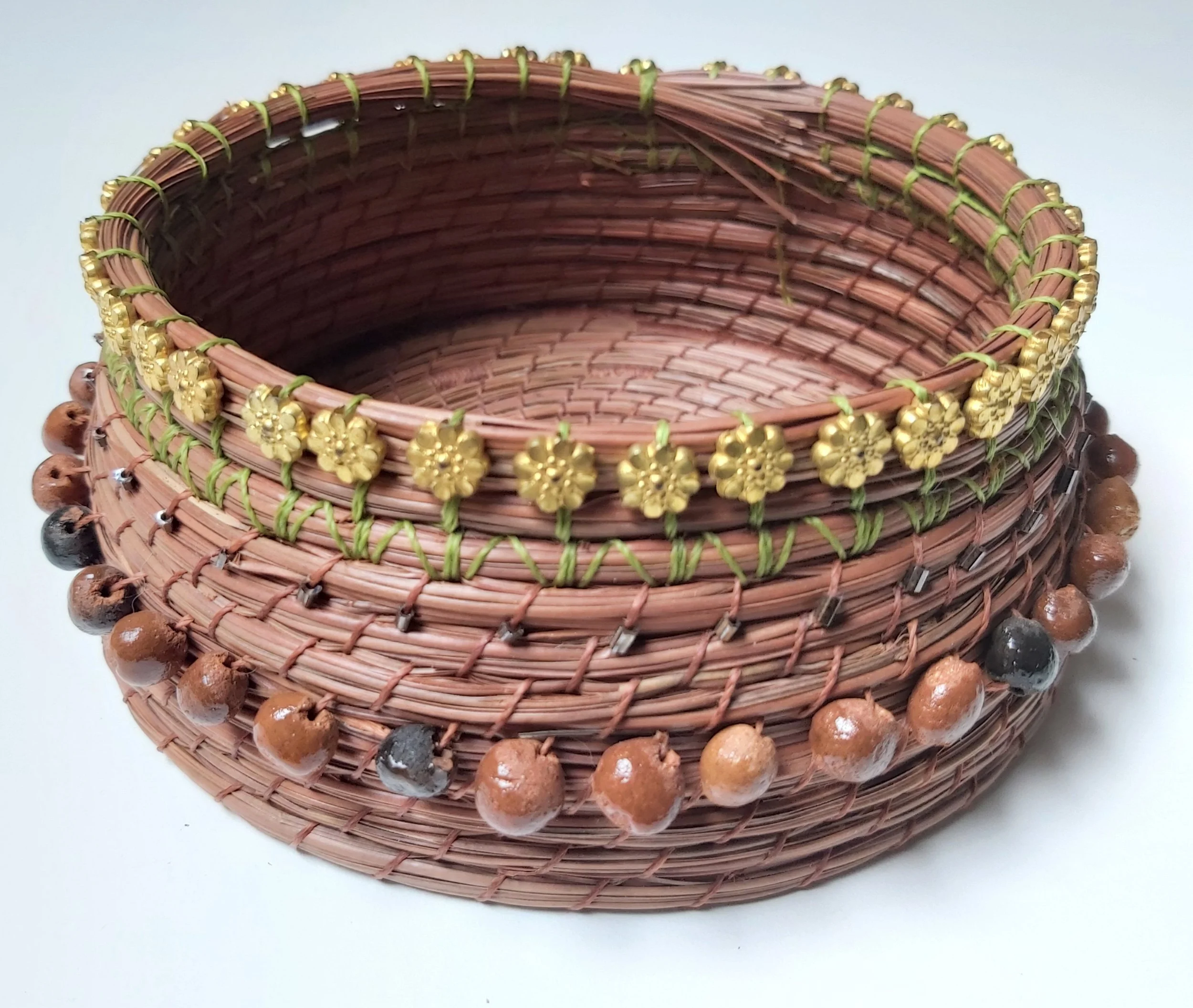 Seeds from Fiji, beads recycled from an old shirt.