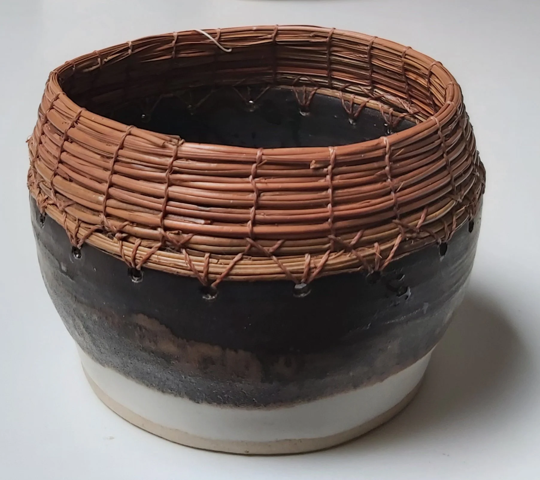 Stoneware with pine needles.