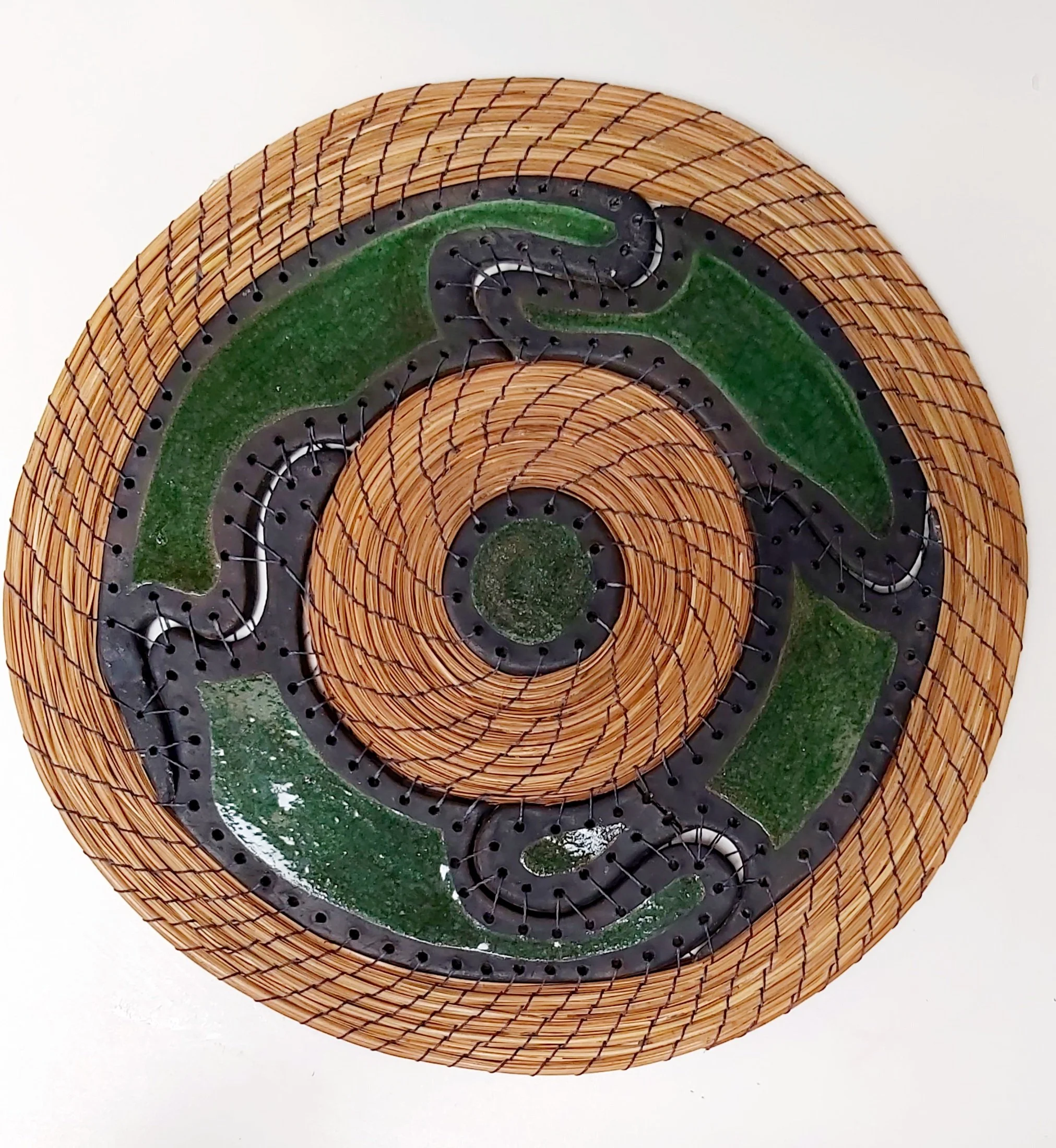 Raku fired ceramics with pine needles, wall art. The snake charmer.