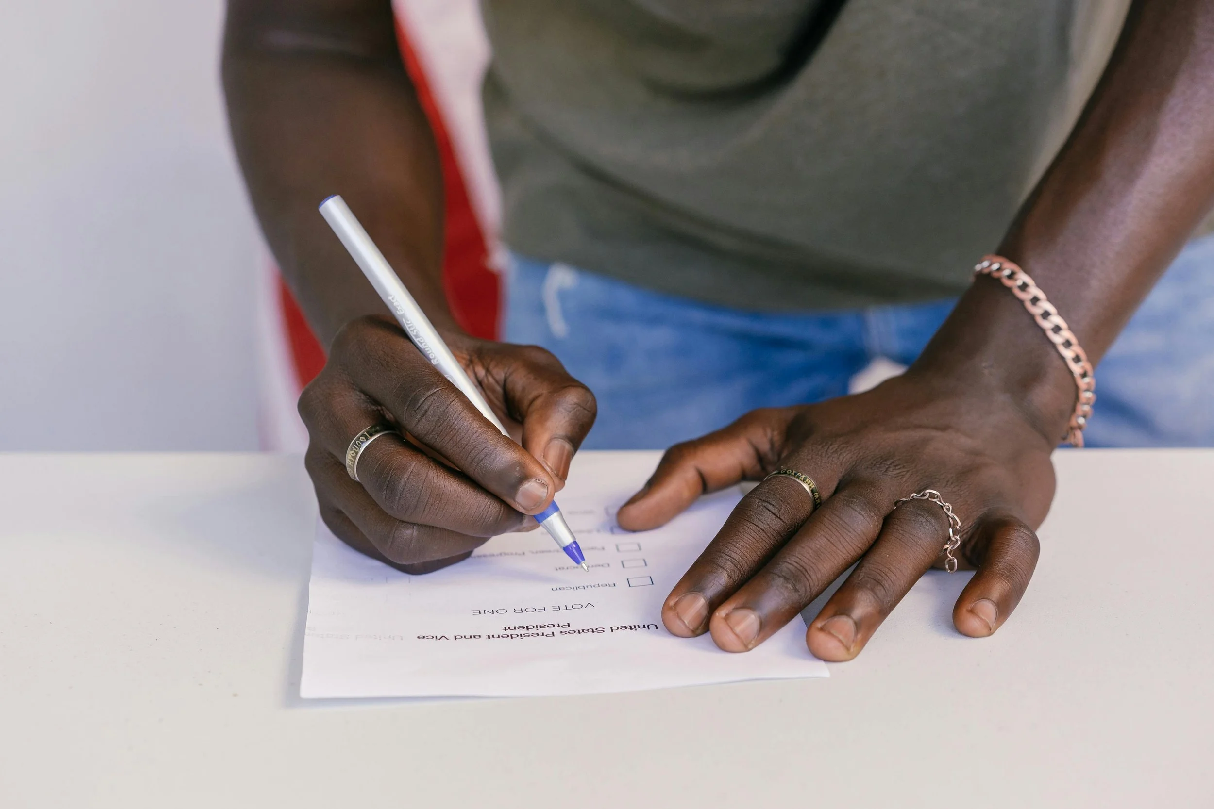 Man filling out ballot