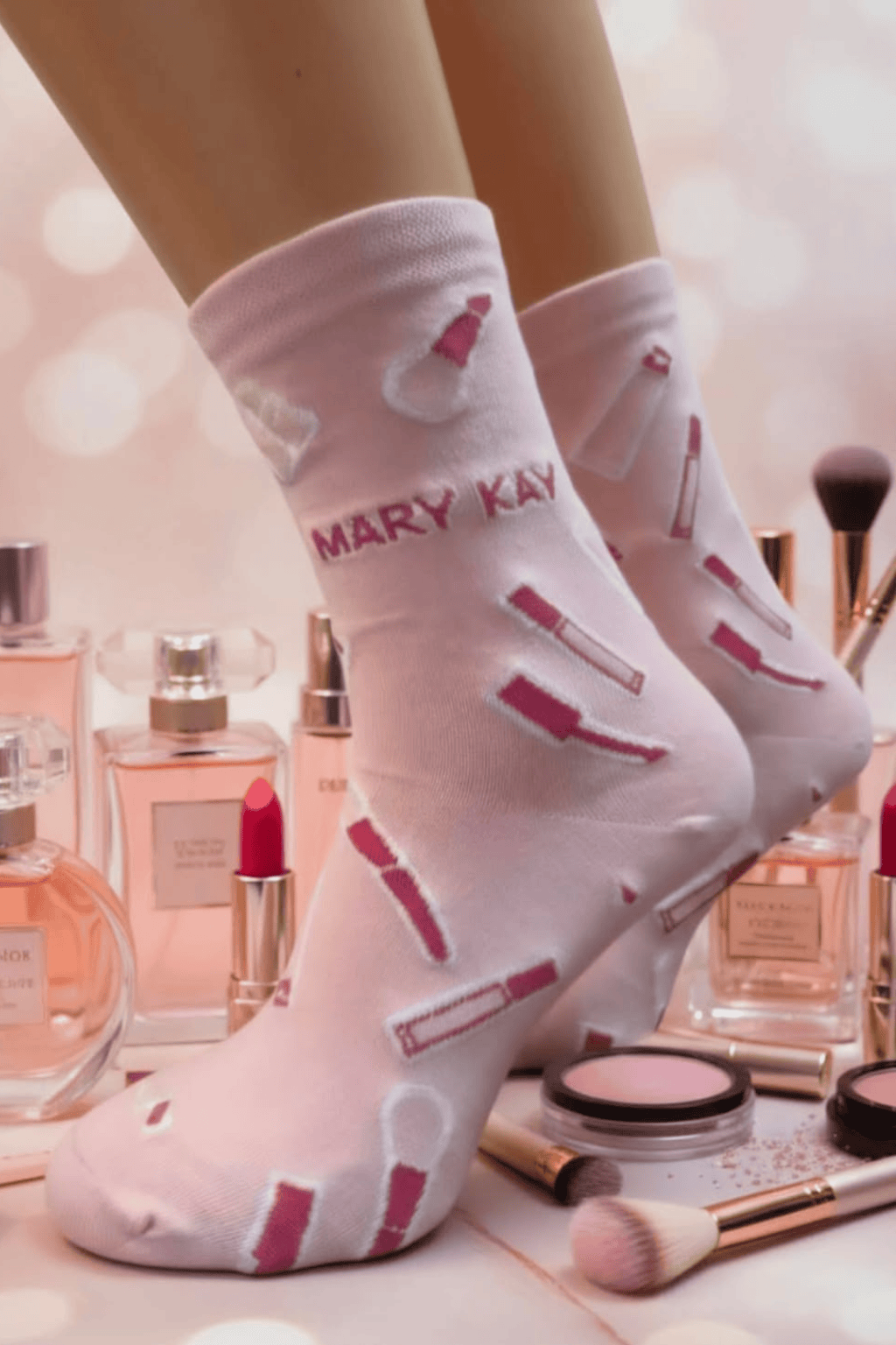 Pink socks with a make-up pattern and MARY KAY logo