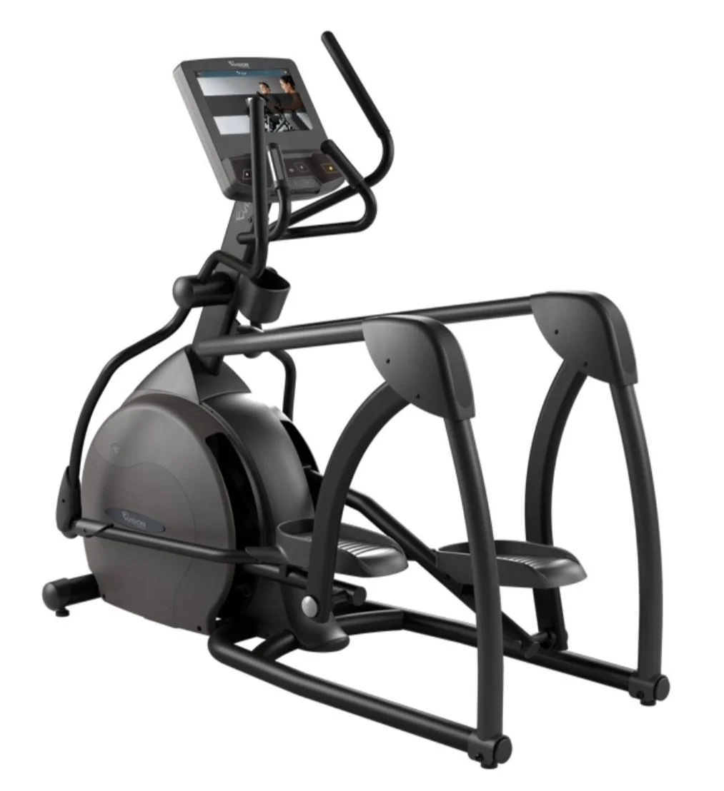 Black elliptical machine with built-in digital screen and arm handles, used for cardiovascular workouts