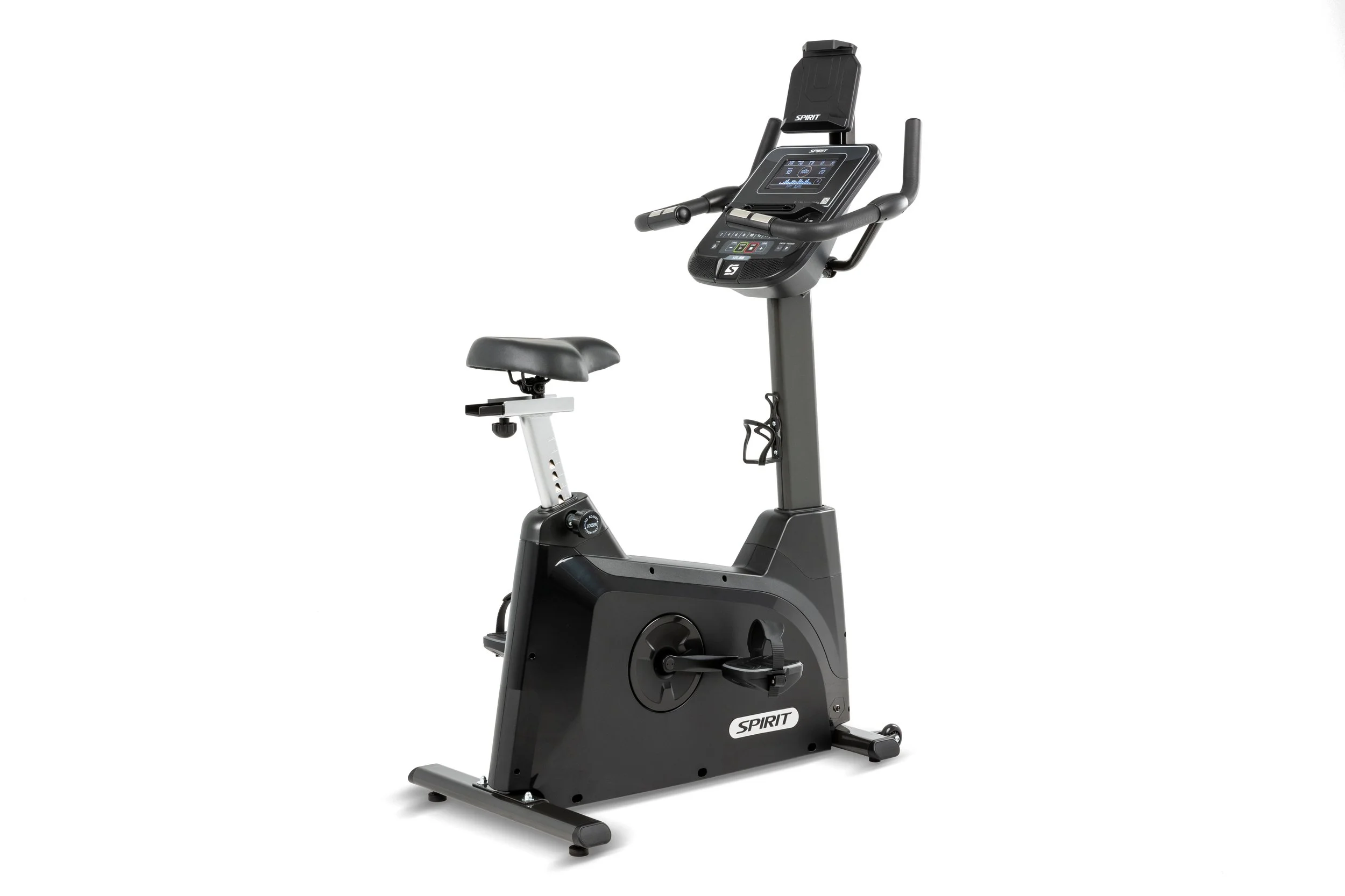 Black upright exercise bike with digital display and handlebars, isolated on white background.