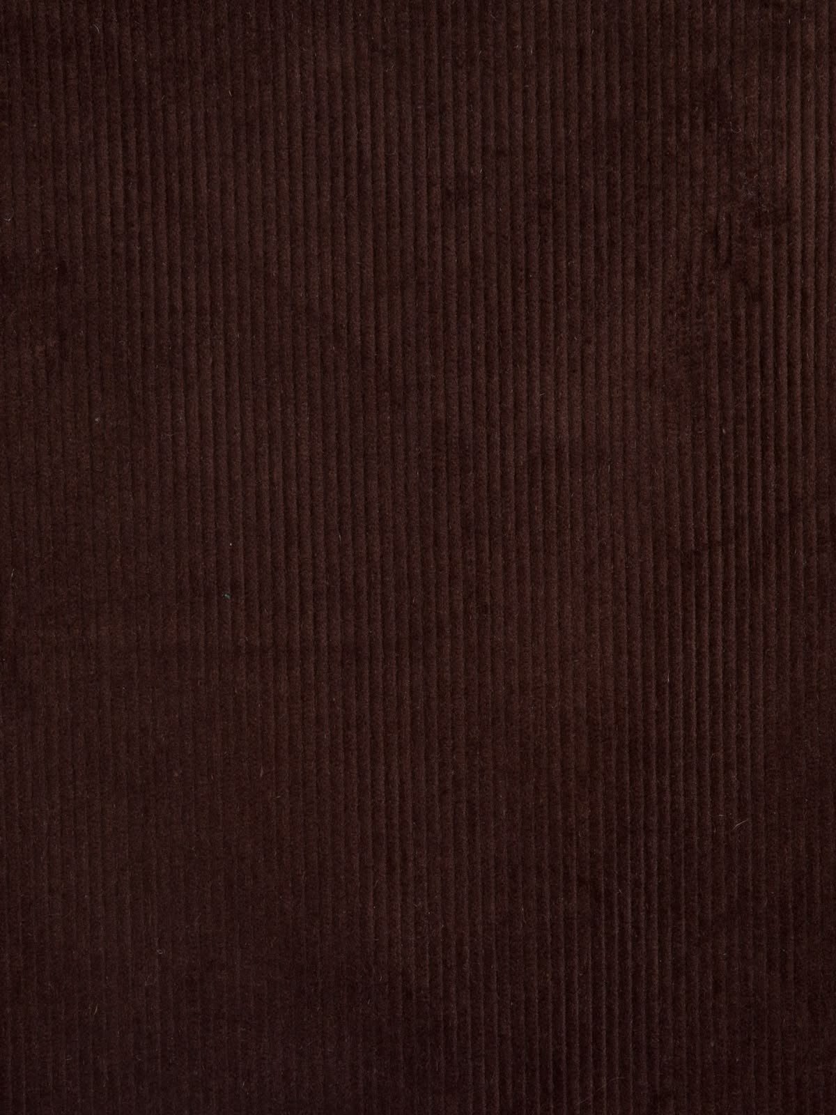 Close-up of a dark brown textured fabric with vertical ribbing.