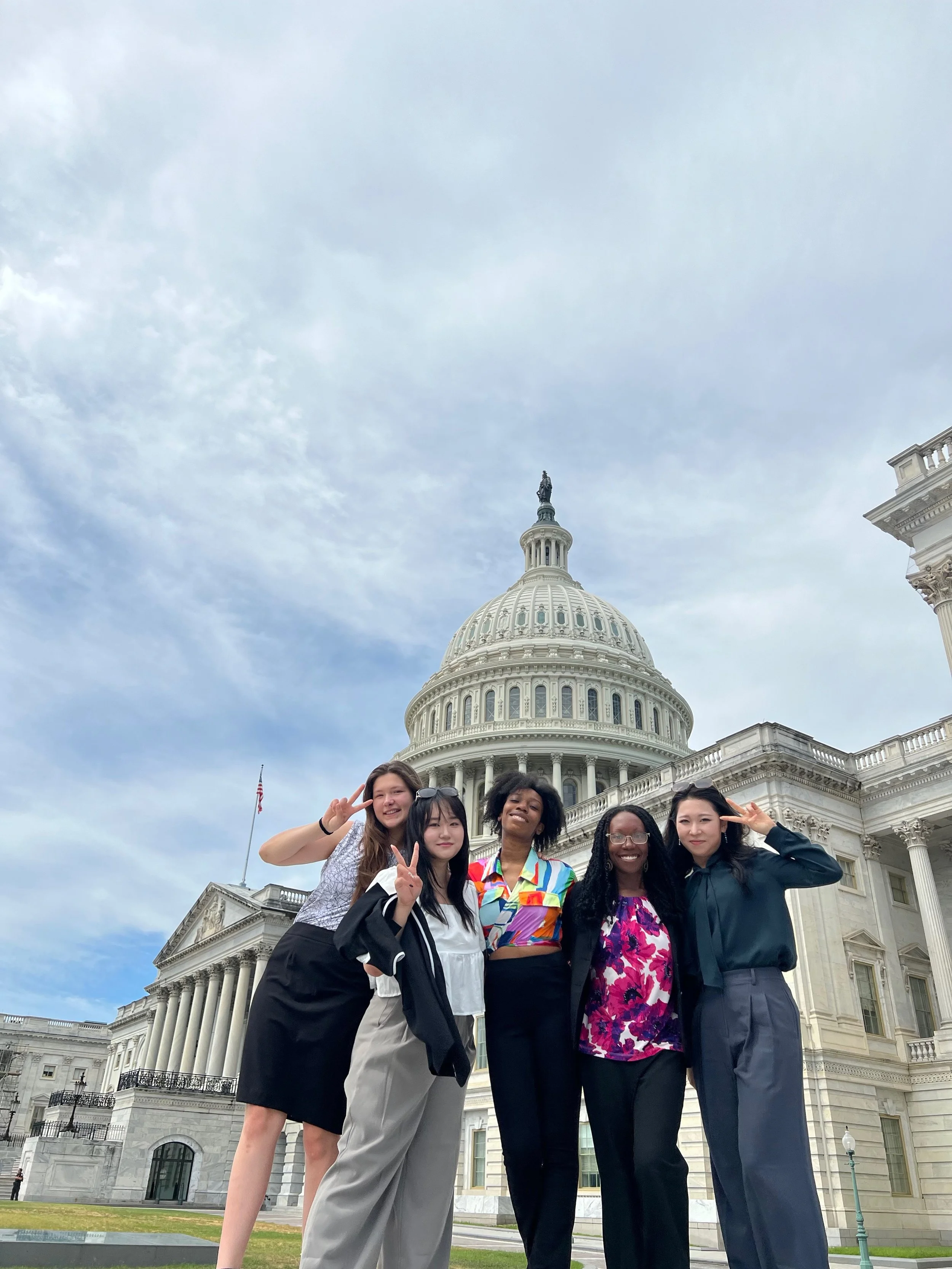KASC delegates smiling in front of the U.S. Capitol Building in Washington, D.C., during the Korea-America Student Conference, showcasing youth diplomacy in action.