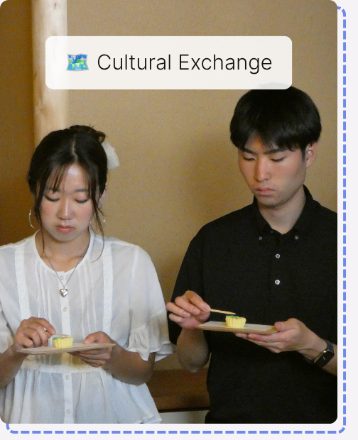 Two students tasting Japanese tea ceremony sweets