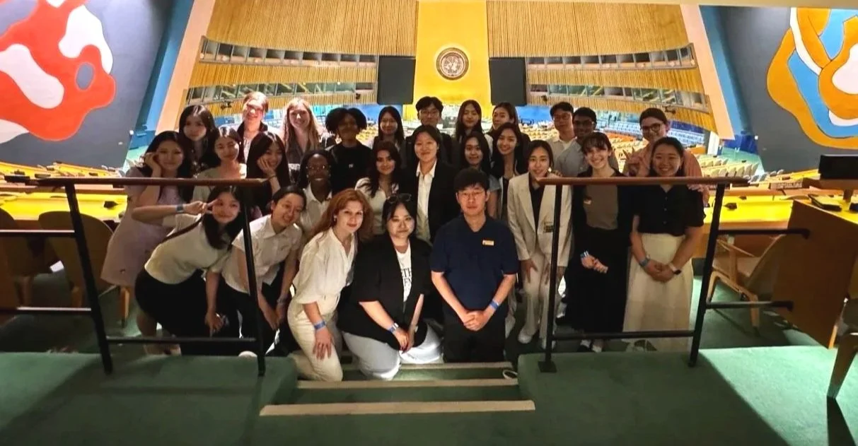 Group photo of JASC and KASC delegates inside the United Nations General Assembly Hall, highlighting international student diplomacy and cross-cultural leadership.