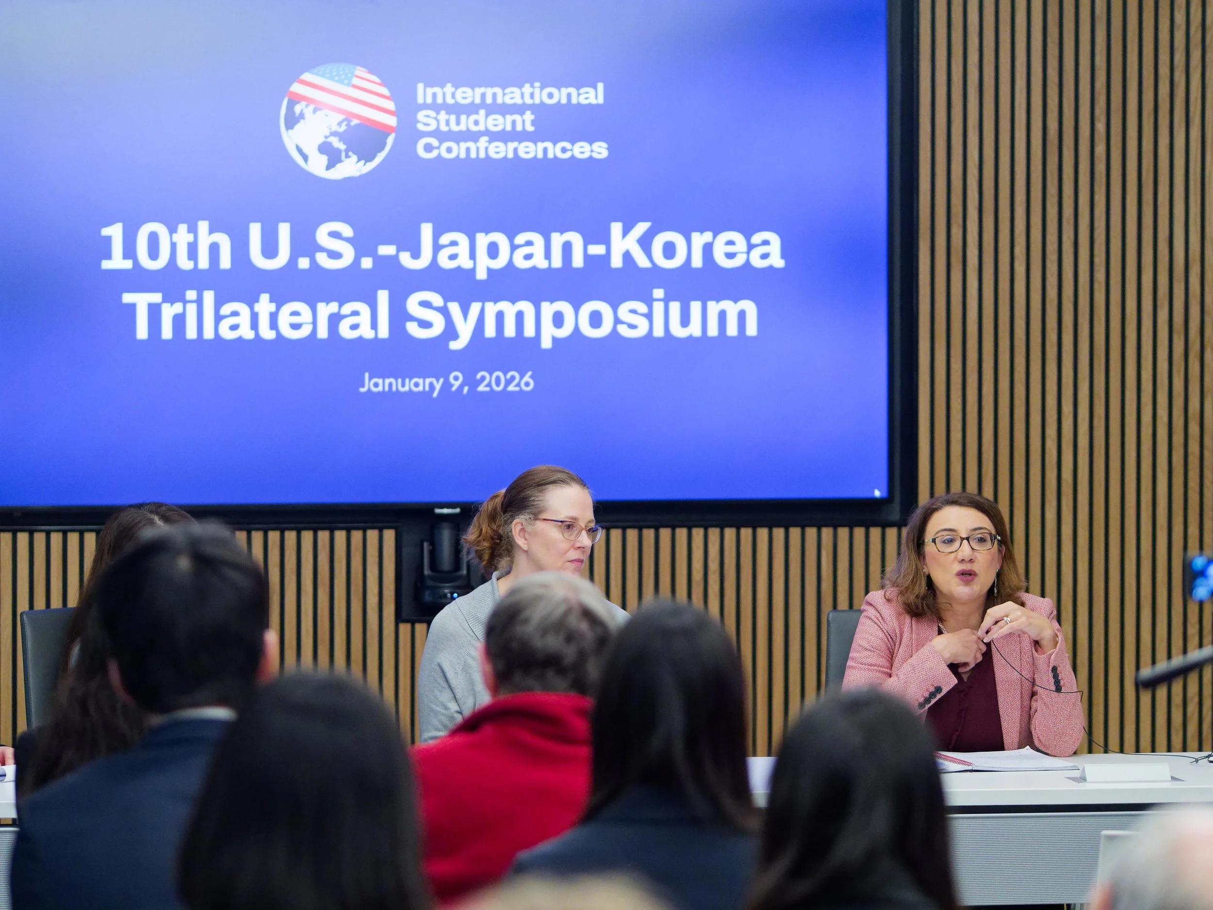 Aging Societies Panel at the 10th Trilateral Forum. Two women sitting at a panel table.