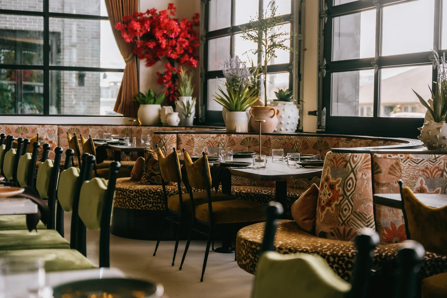 Sirocco's dining room with patterned banquettes and big windows