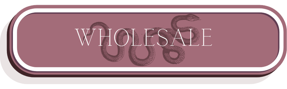 A sign with the word "WHOLESALE" in large letters, with a snake illustration above the text.