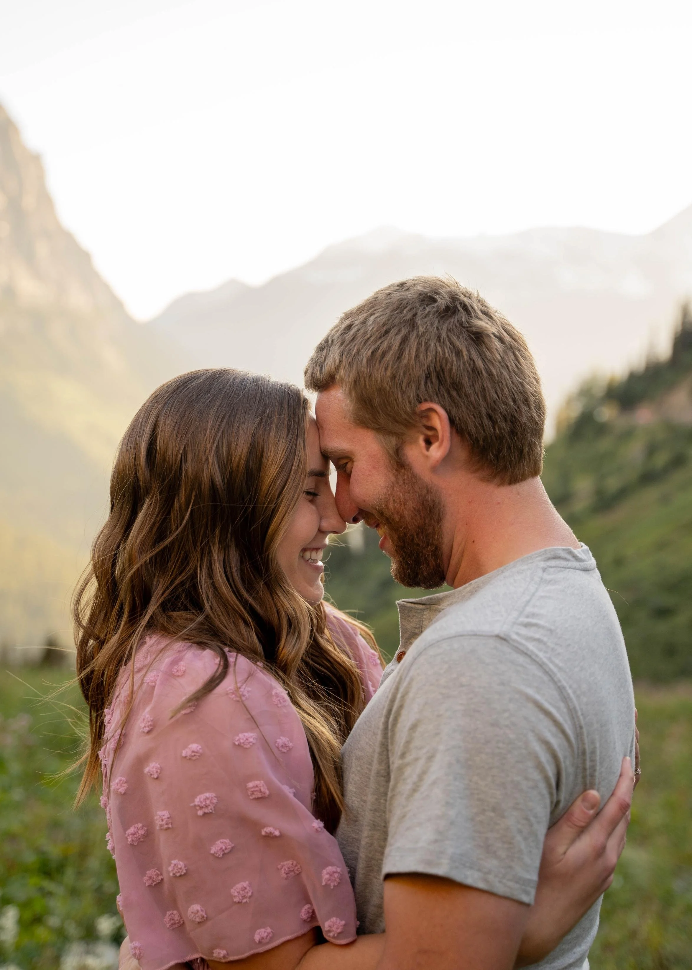 Romantic embrace between a couple outdoors in Glacier National Park