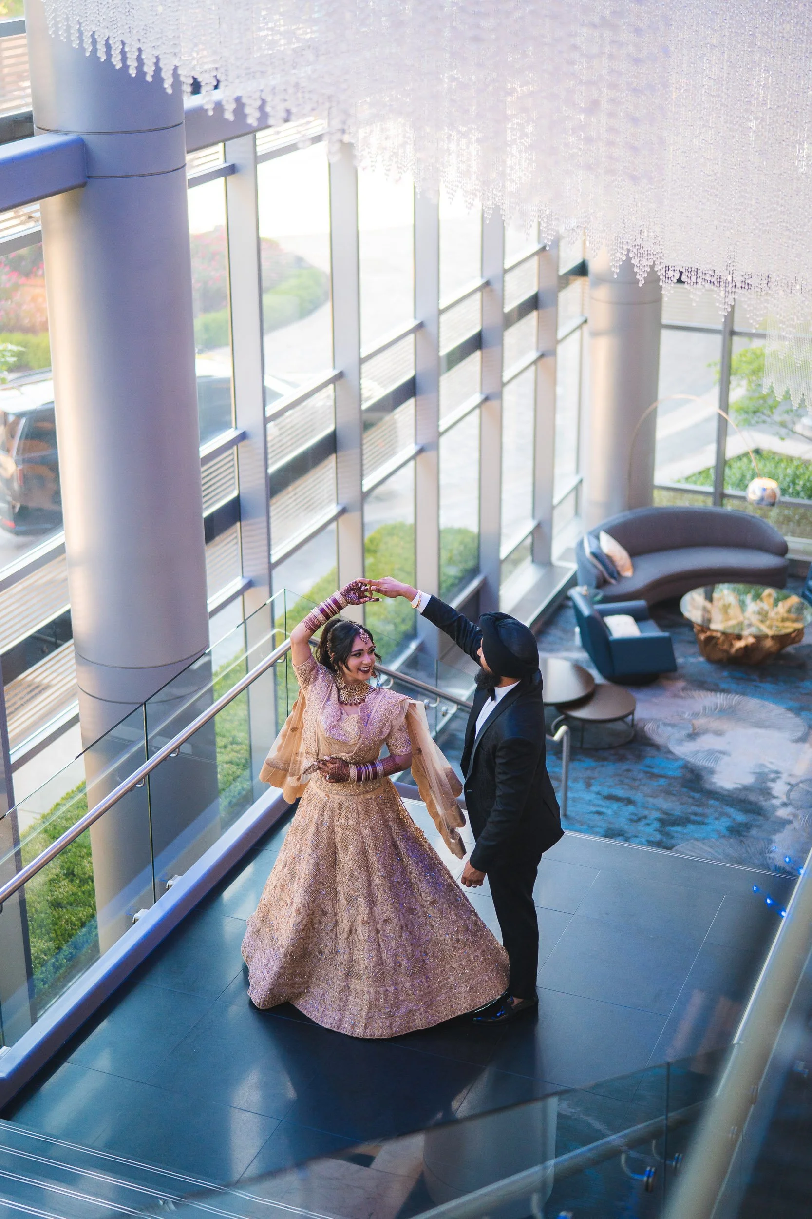 Couple dancing in formal attire at wedding venue