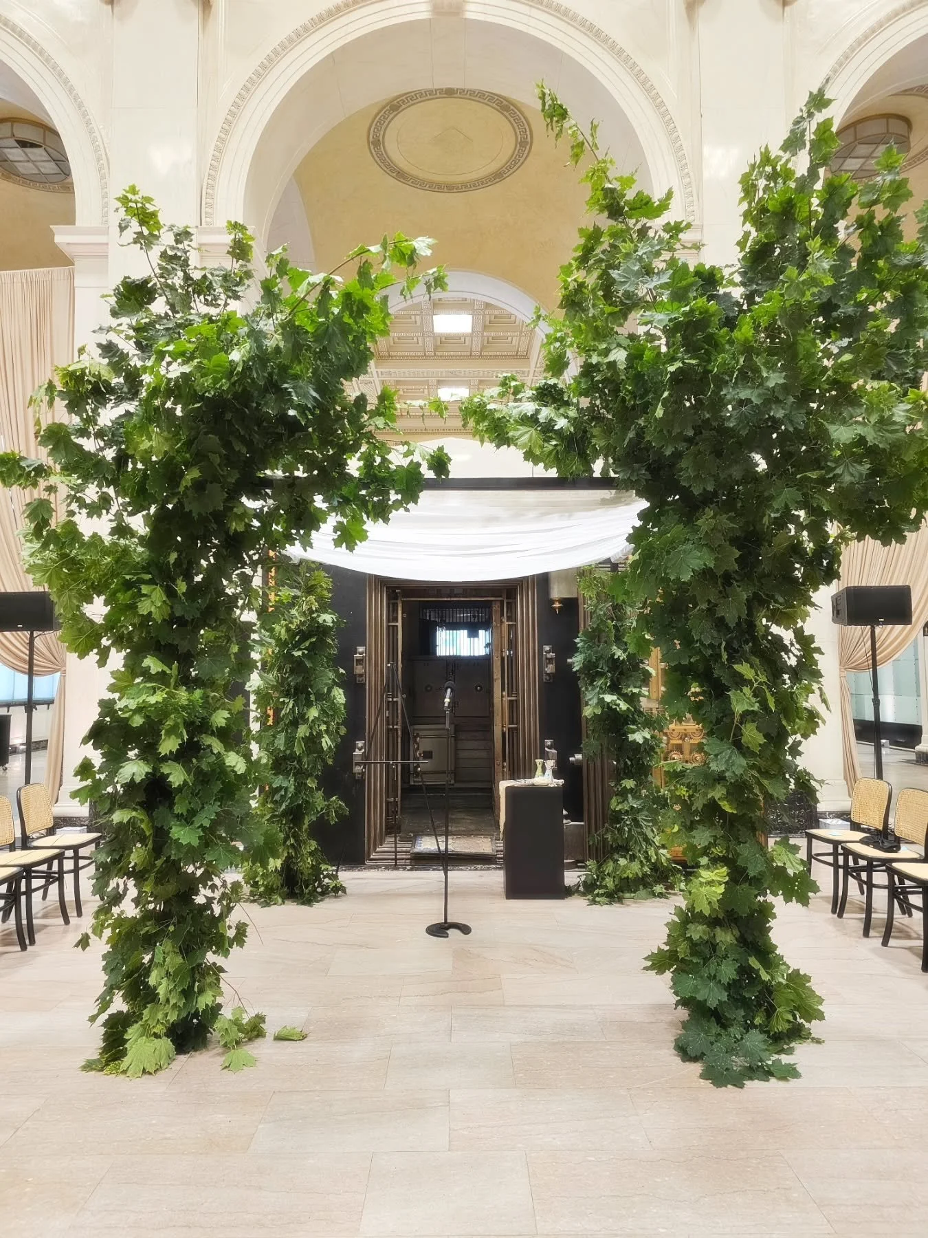 This simple chuppah made of branches looked perfect in front of the vault at the State Savings Bank in Detroit.