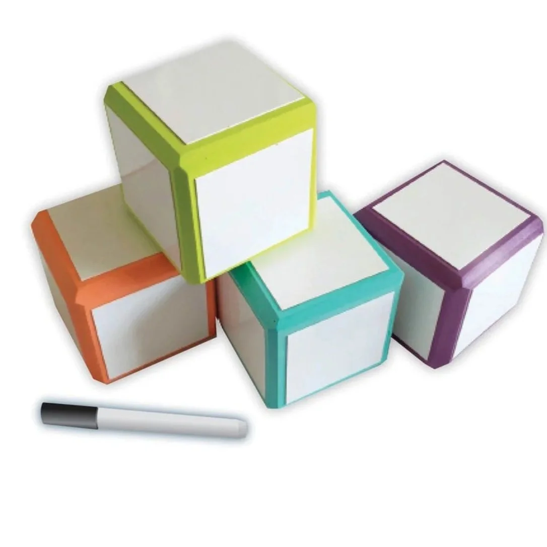 Colorful sticky notes arranged in a square pattern with a whiteboard marker nearby.