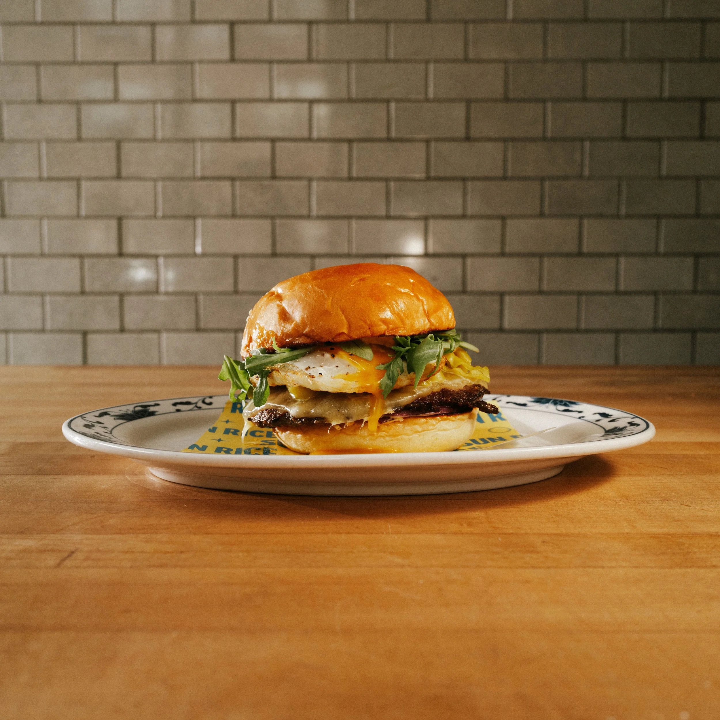 brunch burger . pork egg and cheese sandwich / sando, crispy fish sandwich / sand, egg and cheese breakfast sandwich