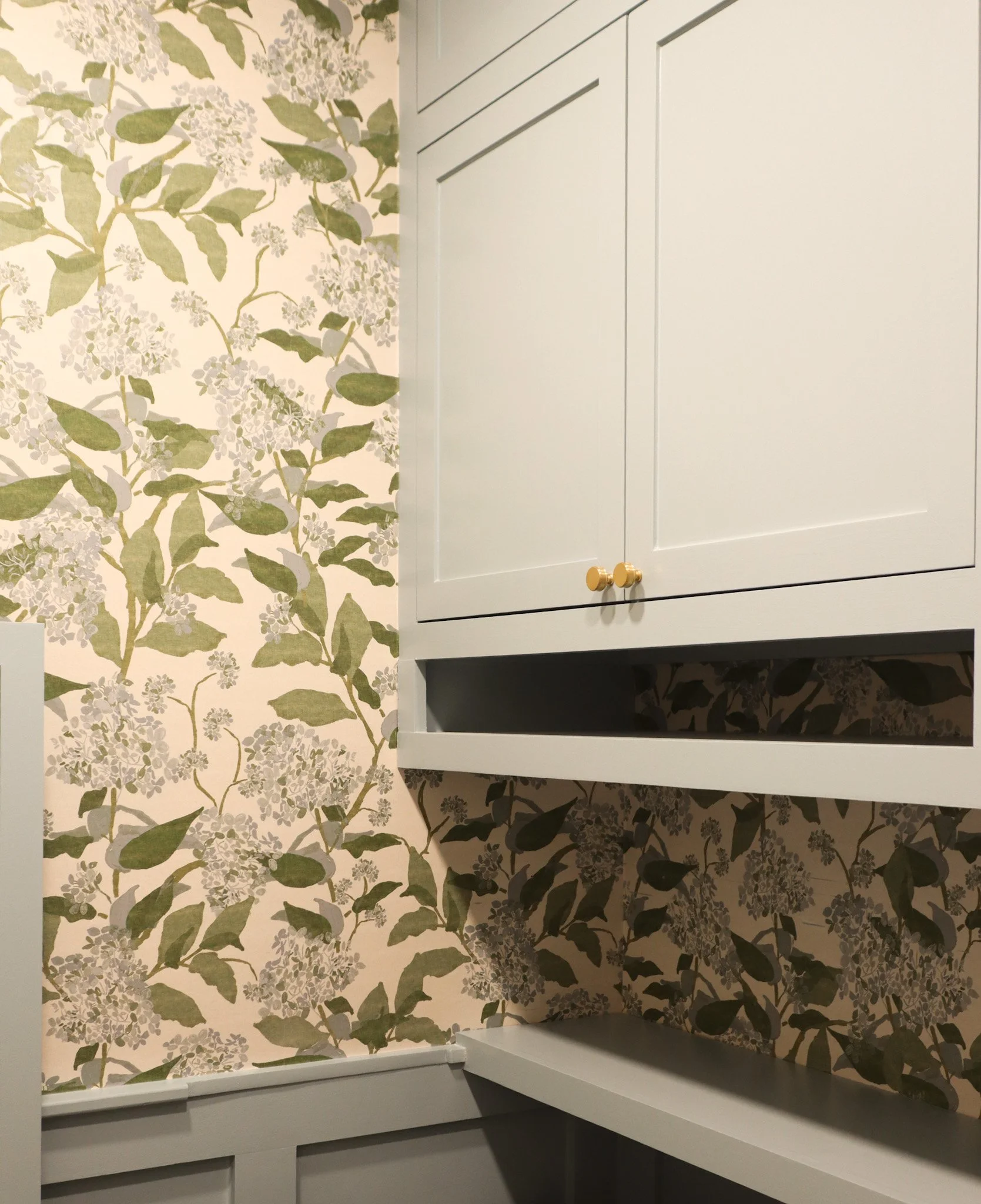 Stylish Laundry Room with Patterned Wallpaper