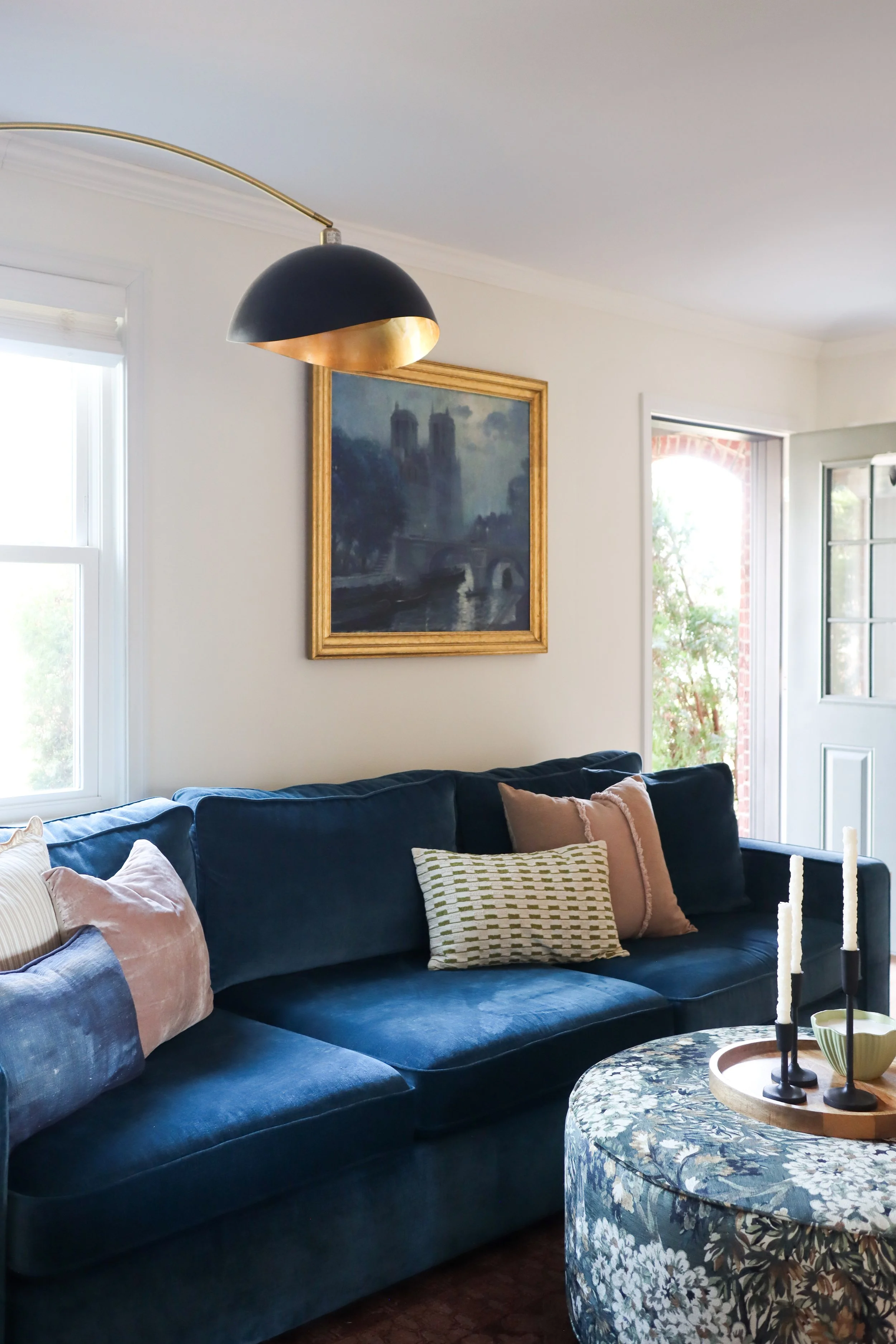 Comfortable and sophisticated living room design with a balanced mix of color, texture, and pattern.