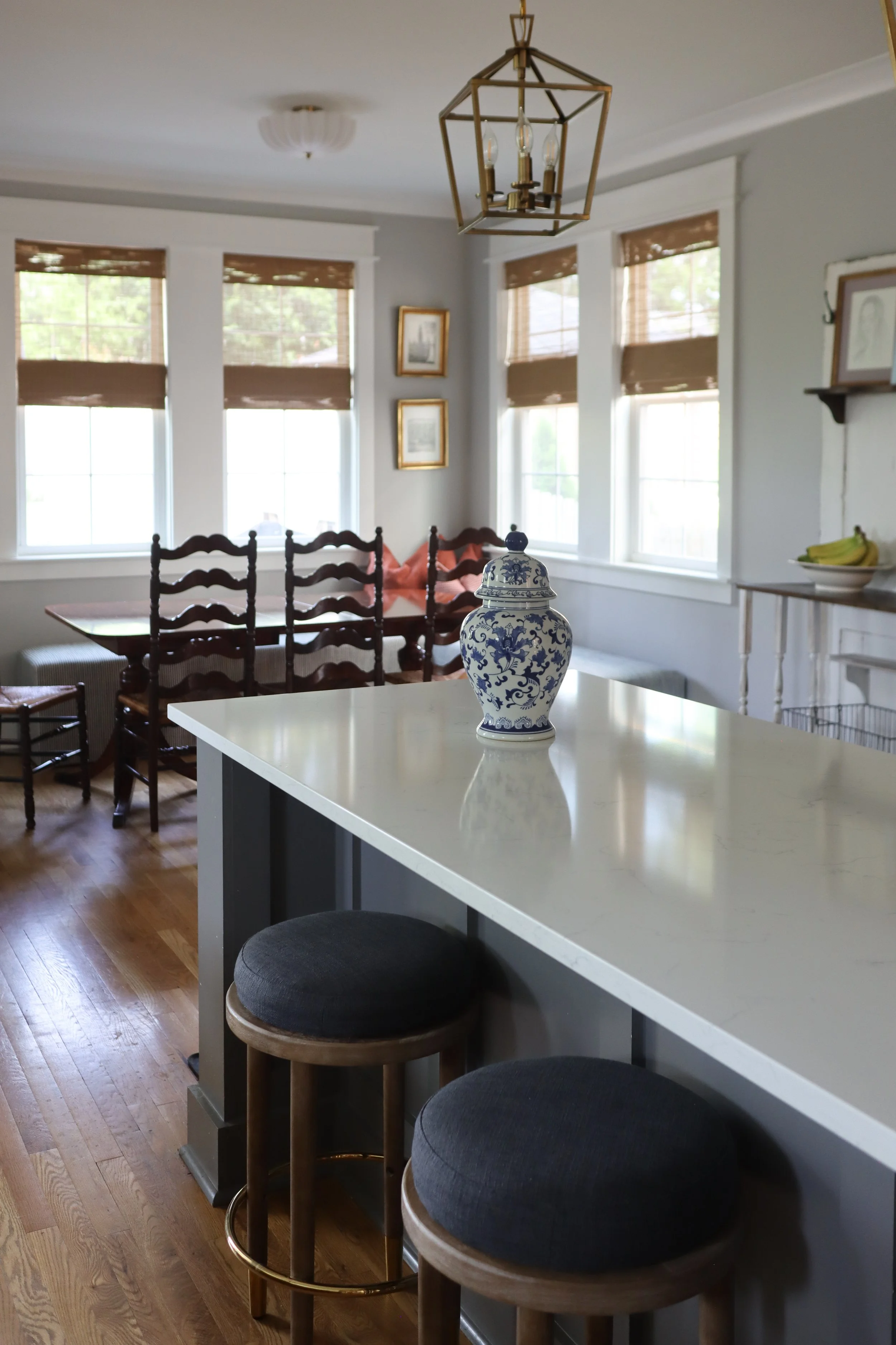 Downstairs design featuring traditional style in the kitchen, dining, and living room. Designed for a Nashville family who wanted warm finishes, timeless details, and functional flow between spaces.