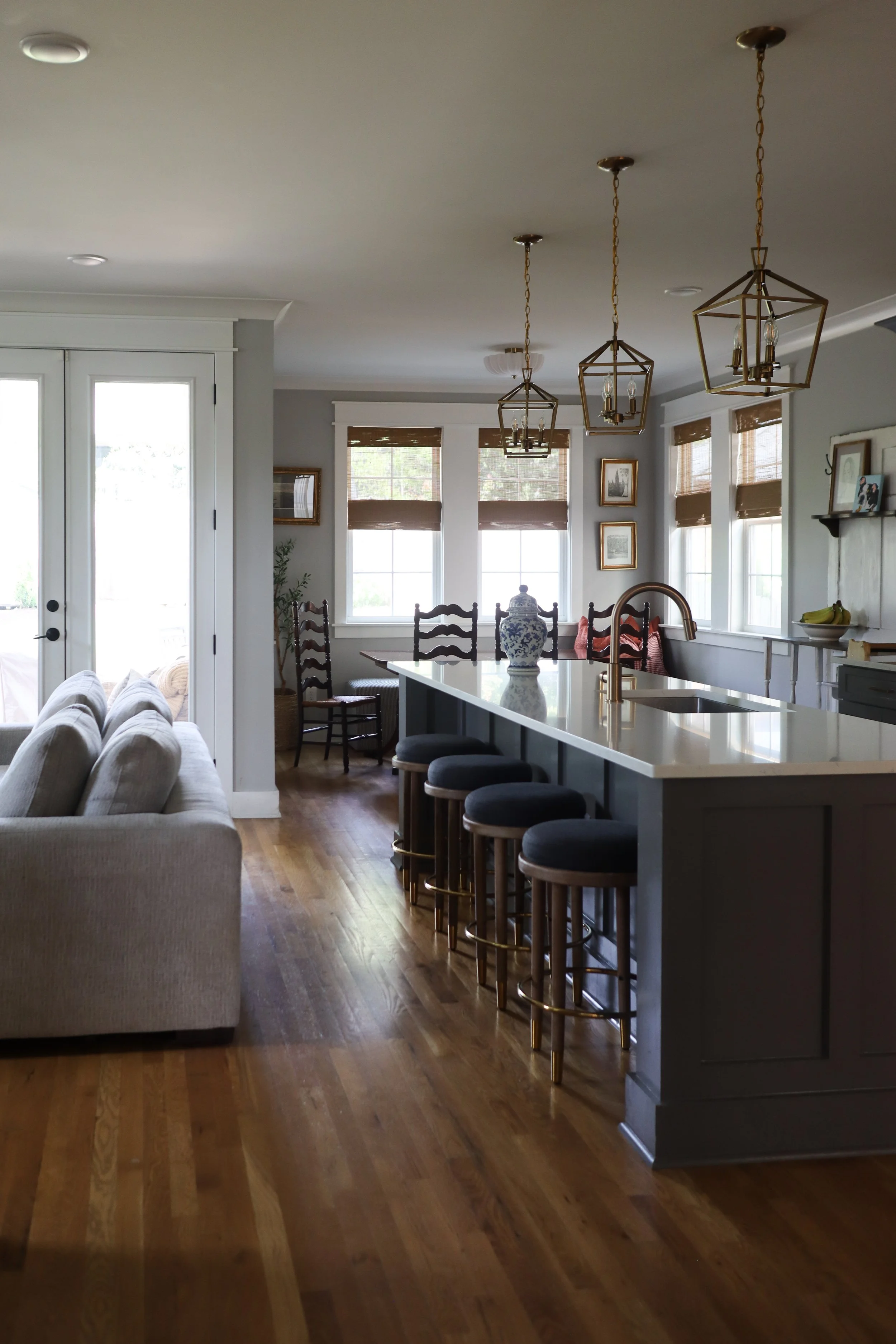Downstairs design featuring traditional style in the kitchen, dining, and living room. Designed for a Nashville family who wanted warm finishes, timeless details, and functional flow between spaces.