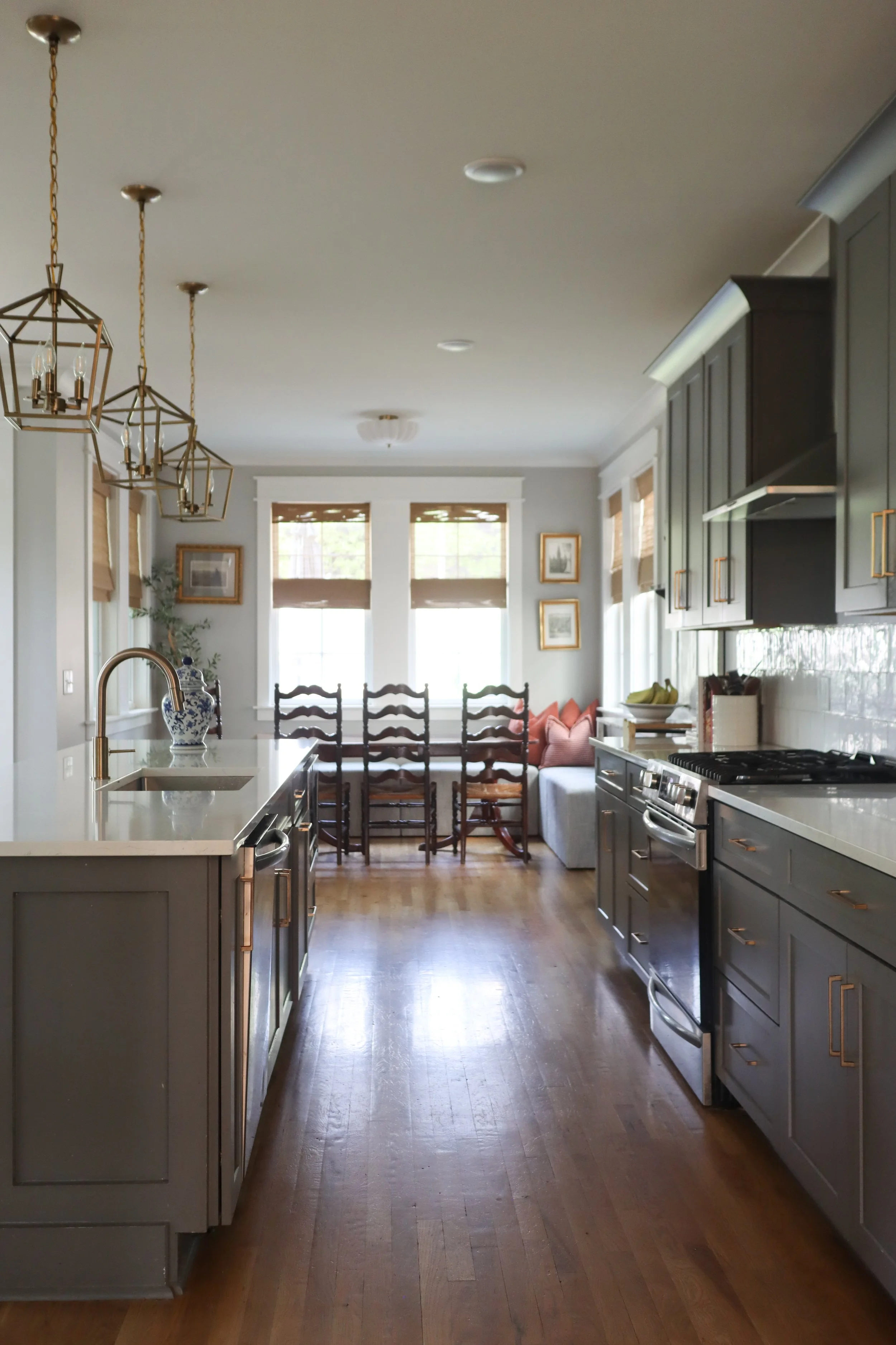 Downstairs design featuring traditional style in the kitchen, dining, and living room. Designed for a Nashville family who wanted warm finishes, timeless details, and functional flow between spaces.