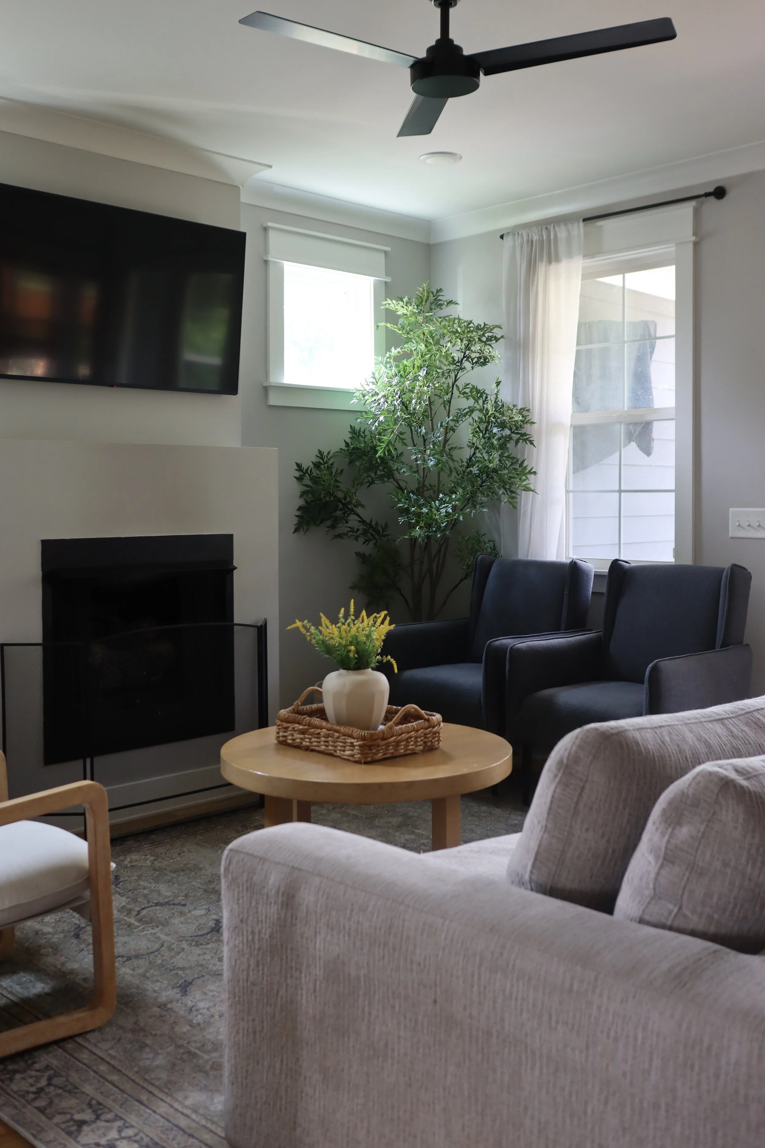 Downstairs design featuring traditional style in the kitchen, dining, and living room. Designed for a Nashville family who wanted warm finishes, timeless details, and functional flow between spaces.