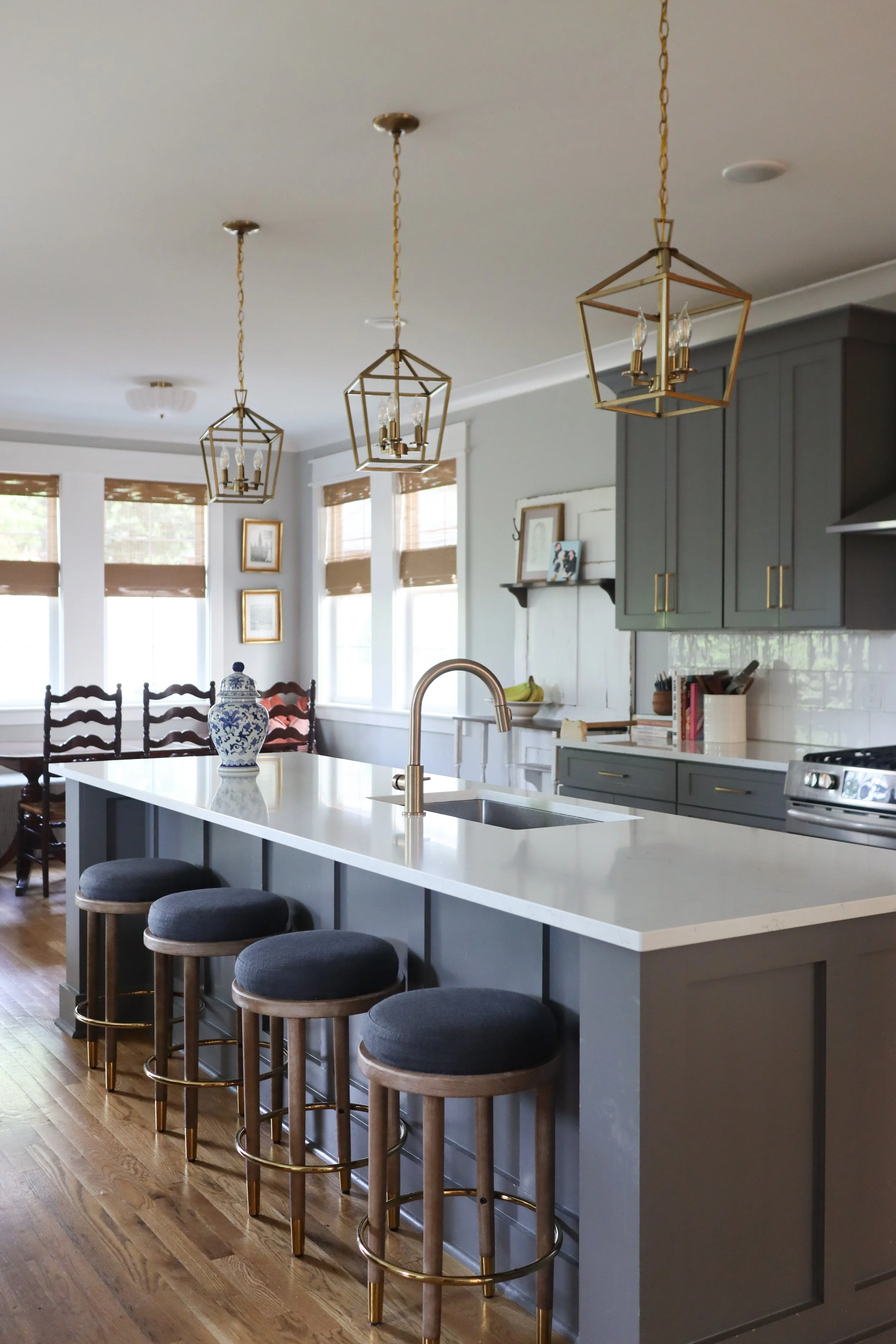 Downstairs design featuring traditional style in the kitchen, dining, and living room. Designed for a Nashville family who wanted warm finishes, timeless details, and functional flow between spaces.