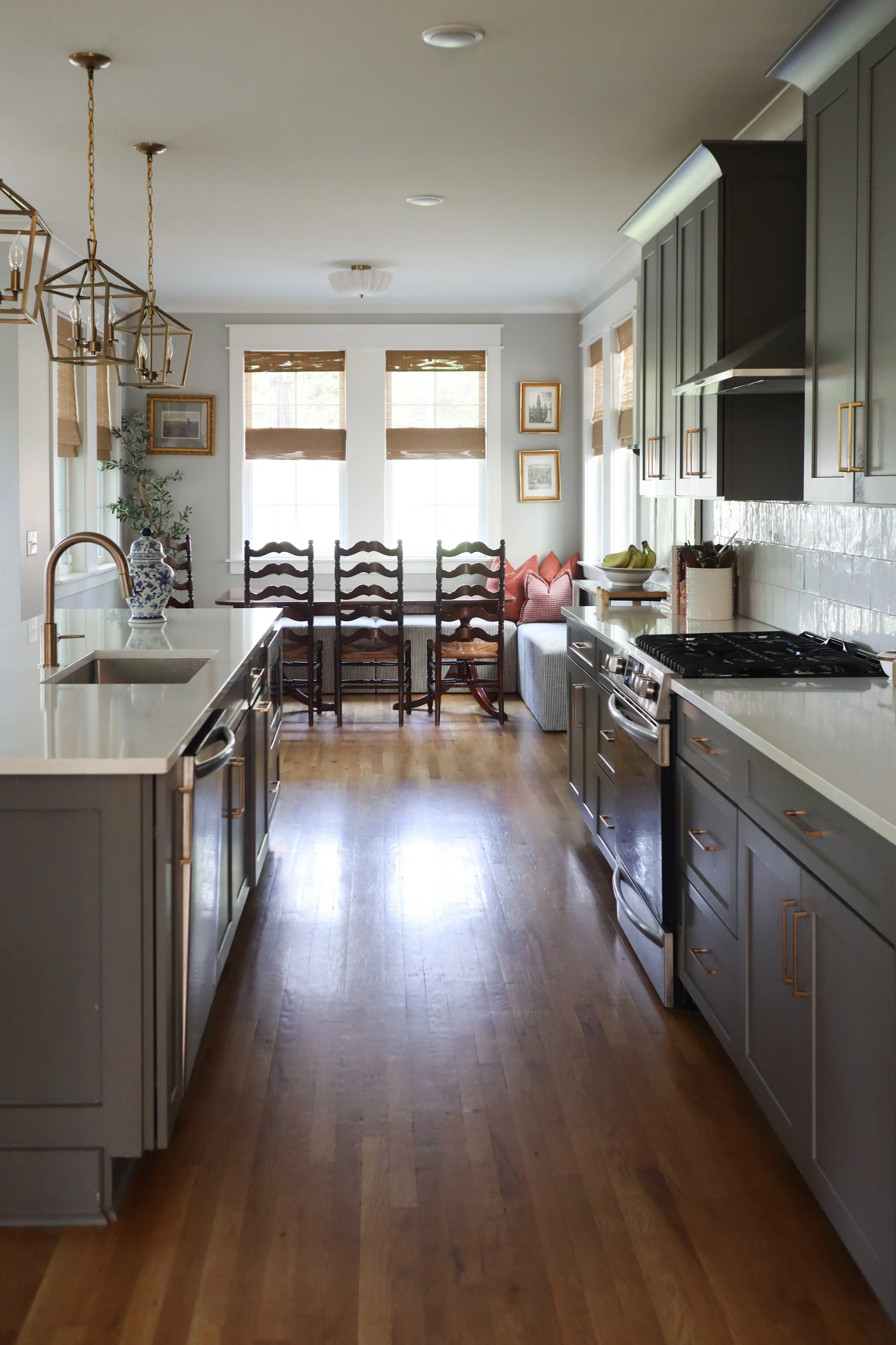 Downstairs design featuring traditional style in the kitchen, dining, and living room. Designed for a Nashville family who wanted warm finishes, timeless details, and functional flow between spaces.