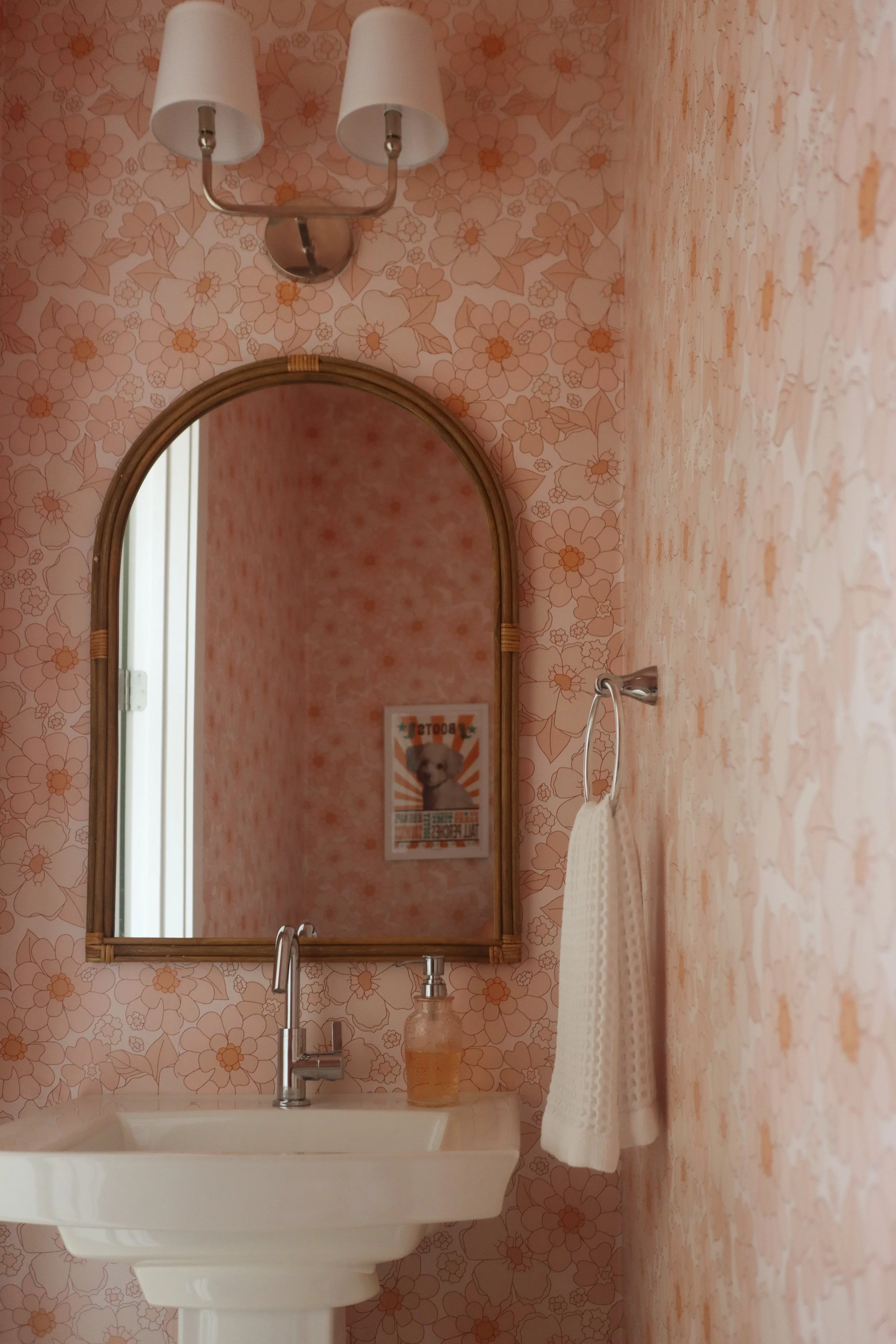 Pink Floral Powder Bath with Full-Wall Wallpaper and Retro 70's Style